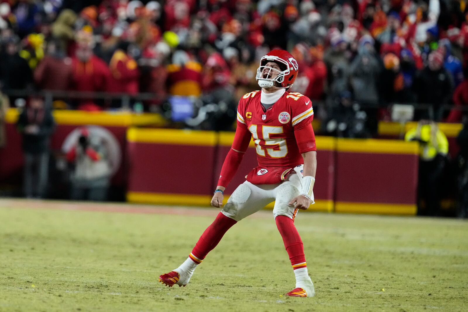 Kansas City Chiefs quarterback Patrick Mahomes (15) celebrates after defeating the Buffalo Bills in the AFC Championship NFL football game, Sunday, Jan. 26, 2025, in Kansas City, Mo. (AP Photo/Ed Zurga)