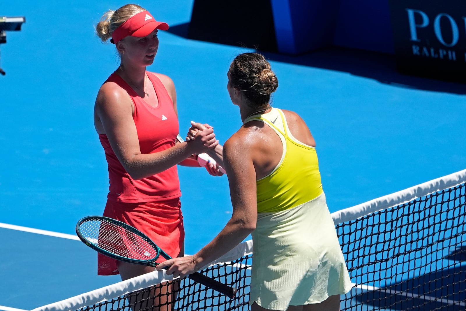 Aryna Sabalenka, right, of Belarus is congratulated by Clara Tauson of Denmark following their third round match at the Australian Open tennis championship in Melbourne, Australia, Friday, Jan. 17, 2025. (AP Photo/Asanka Brendon Ratnayake)