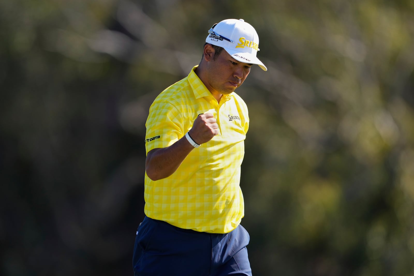 Hideki Matsuyama, of Japan, reacts after sinking a putt on the 18th hole to win The Sentry golf event, Sunday, Jan. 5, 2025, at Kapalua Plantation Course in Kapalua, Hawaii. (AP Photo/Matt York)