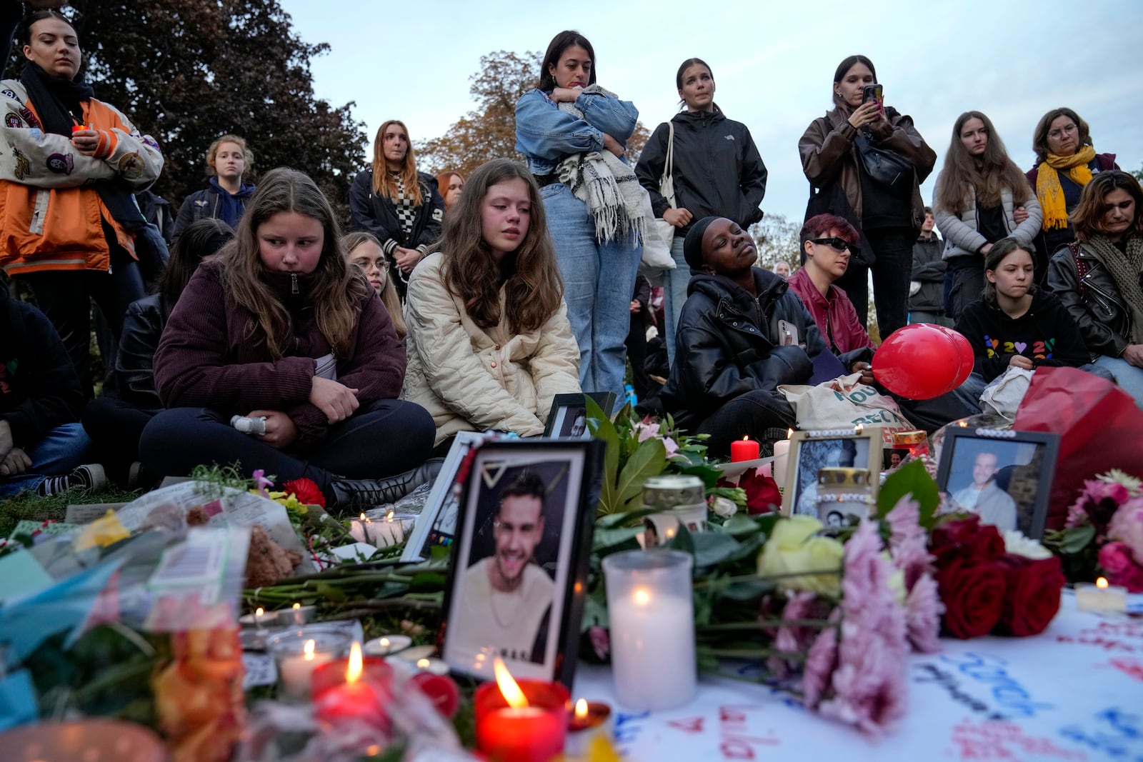 Fans gather to pay tribute to late British singer Liam Payne, former member of the British pop band One Direction in Treptower Park in Berlin, Germany, Sunday, Oct. 20, 2024. (AP Photo/Ebrahim Noroozi)