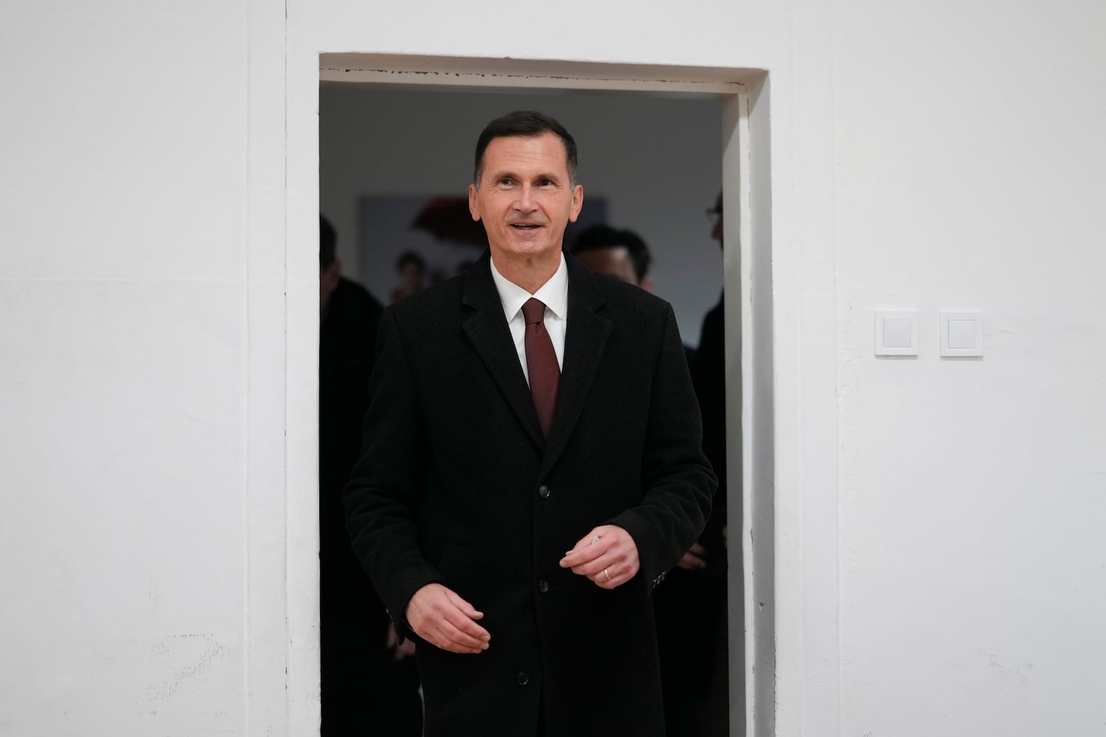 Dragan Primorac, the candidate of the ruling Croatian Democratic Union (HDZ) arrives at a polling station during a presidential election in Zagreb, Croatia, Sunday, Dec. 29, 2024. (AP Photo/Darko Bandic)