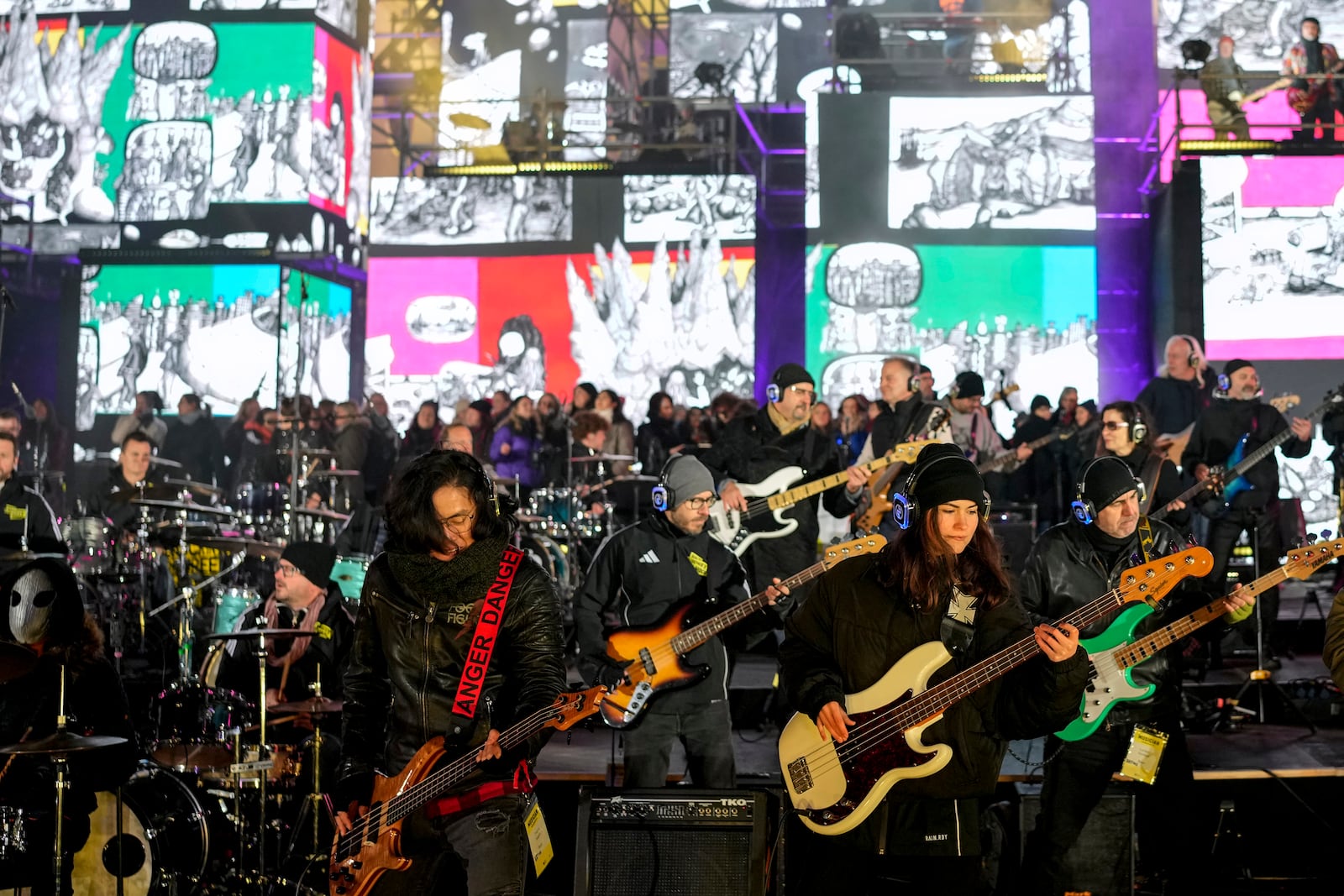 Musicians play on the stage during the concert for freedom for the 35th anniversary of the fall of the Berlin Wall, at the Brandenburg Gate in Berlin, Germany, Saturday, Nov. 9, 2024. (AP Photo/Ebrahim Noroozi)