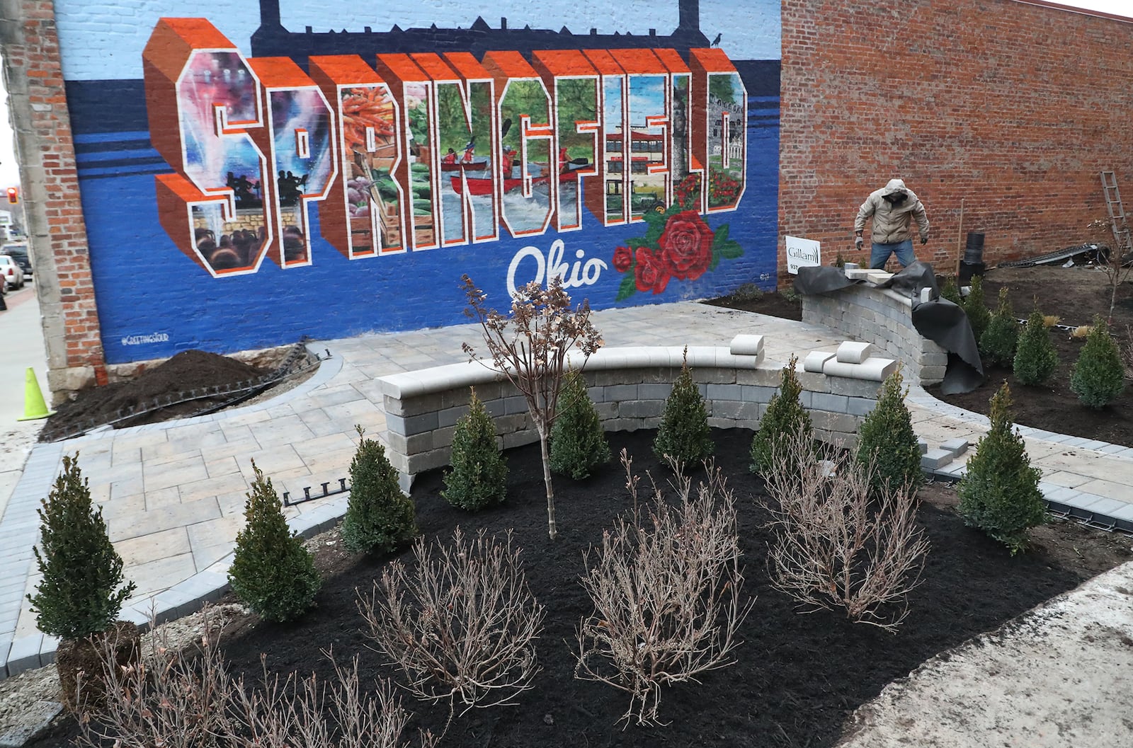 Work continues on the new pocket park along Fountain Avenue Wednesday. The new park is located in the space where an old building was demolished. BILL LACKEY/STAFF