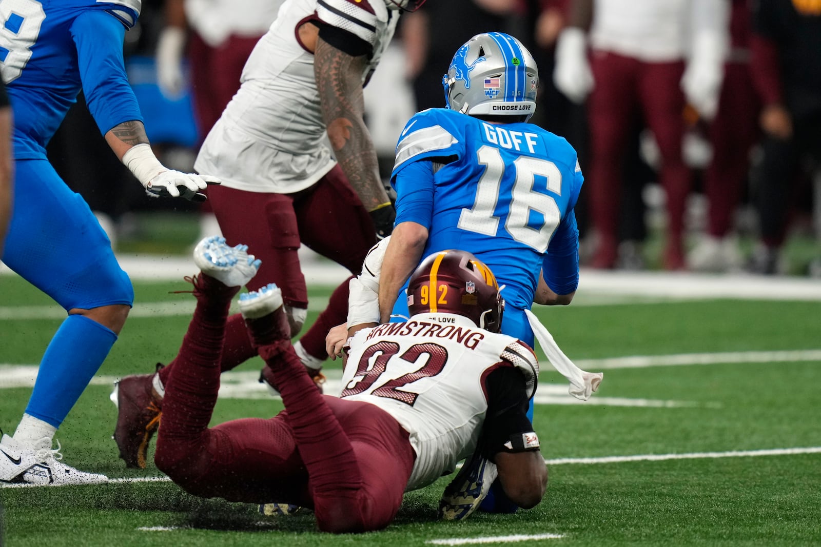 Washington Commanders defensive end Dorance Armstrong (92) sacks Detroit Lions quarterback Jared Goff (16) during the second half of an NFL football divisional playoff game, Saturday, Jan. 18, 2025, in Detroit. (AP Photo/Seth Wenig)