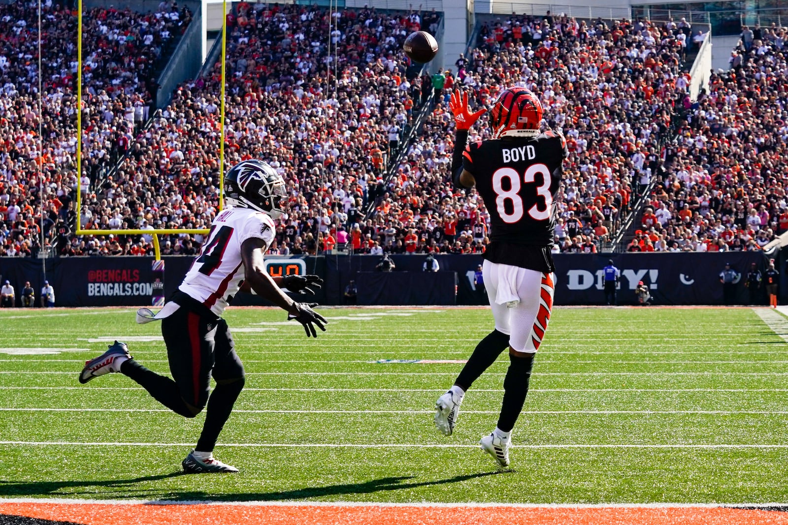 Cincinnati Bengals wide receiver Tyler Boyd (83) makes a catch in front of Atlanta Falcons cornerback Darren Hall (34) in the first half of an NFL football game in Cincinnati, Sunday, Oct. 23, 2022. (AP Photo/Jeff Dean)