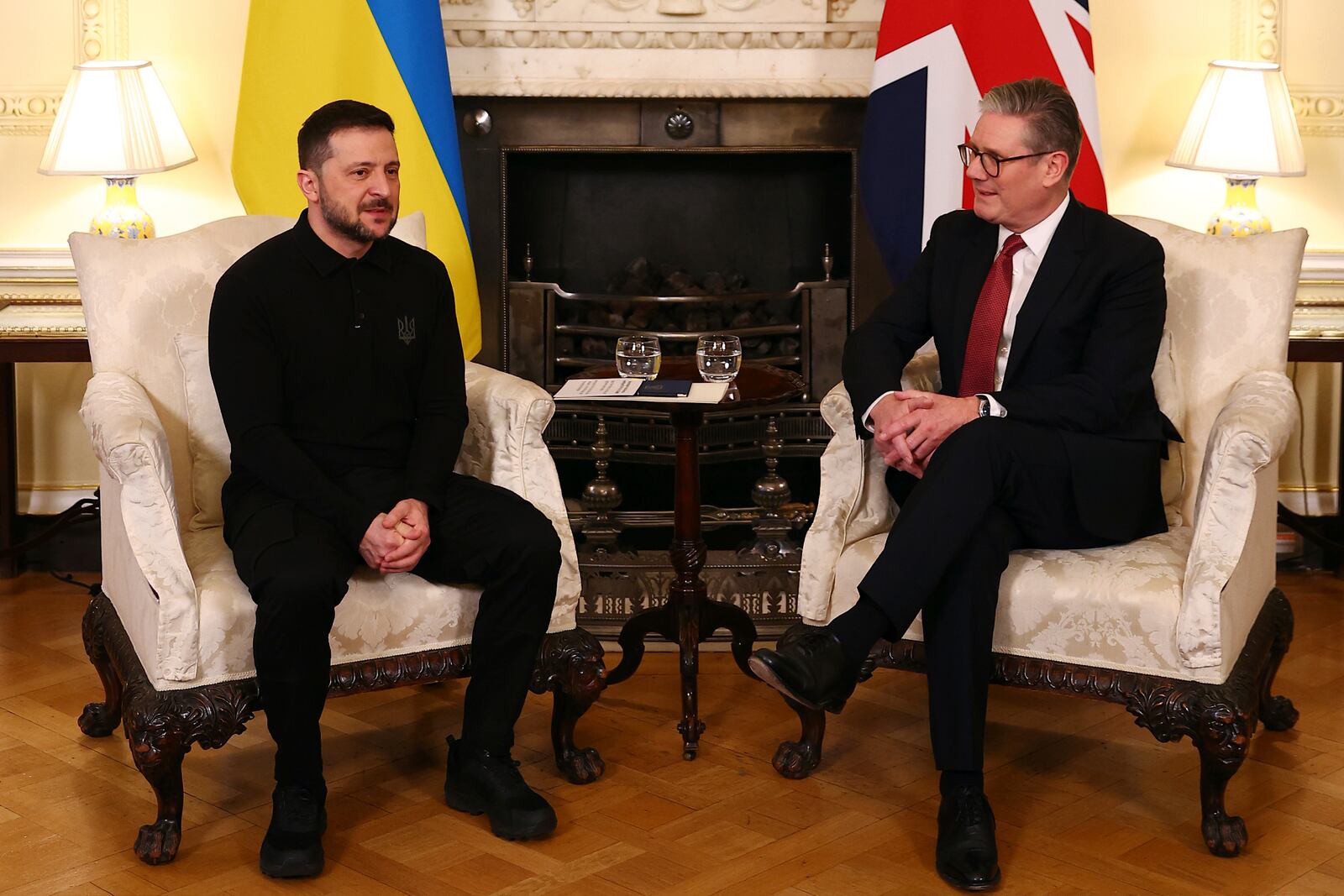 Britain's Prime Minister Keir Starmer, right, and Ukraine's President Volodymyr Zelenskyy, left, talk during a meeting at 10 Downing Street in London, England, Saturday, March 1, 2025. (Peter Nicholls/Pool Photo via AP)