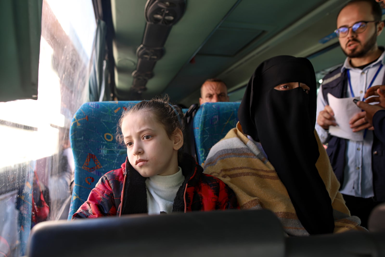 Palestinians wounded in the Israeli bombardment of the Gaza Strip wait before crossing the Rafah border into Egypt, as wounded and sick Palestinians are allowed to leave the Gaza Strip for medical treatment, in Khan Younis, Saturday Feb. 1, 2025. (AP Photo/Jehad Alshrafi)