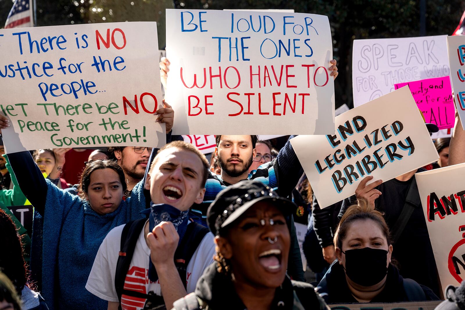 Michael Martinez joins several hundred demonstrators rallying against President Donald Trump outside the California State Capitol on Wednesday, Feb. 5, 2025, in Sacramento, Calif. (AP Photo/Noah Berger)