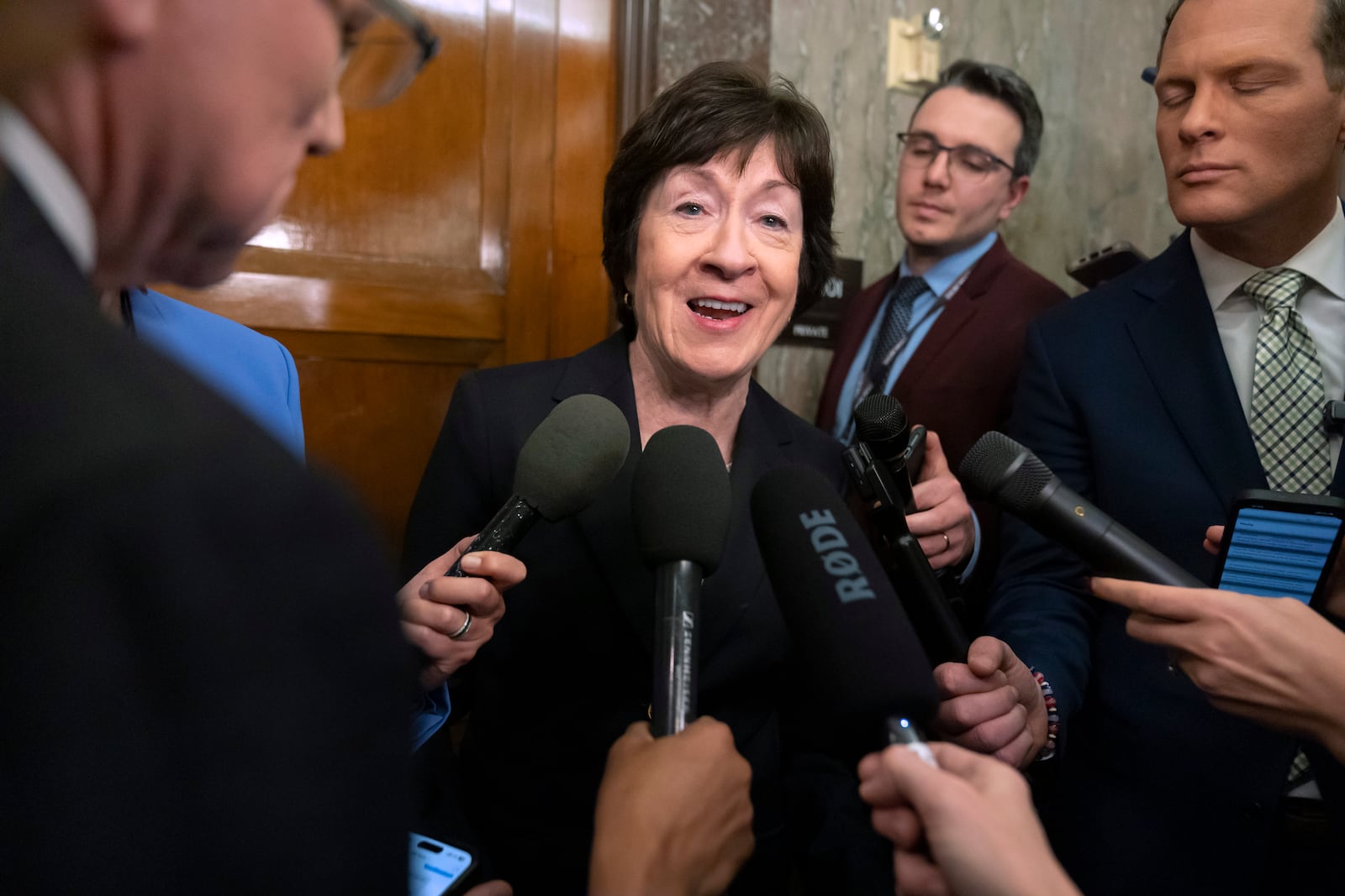 Sen. Susan Collins, R-Maine, speaks with reporters after meeting with Pete Hegseth, President-elect Donald Trump's choice to be defense secretary, on Capitol Hill, Wednesday, Dec. 11, 2024, in Washington. (AP Photo/Mark Schiefelbein)