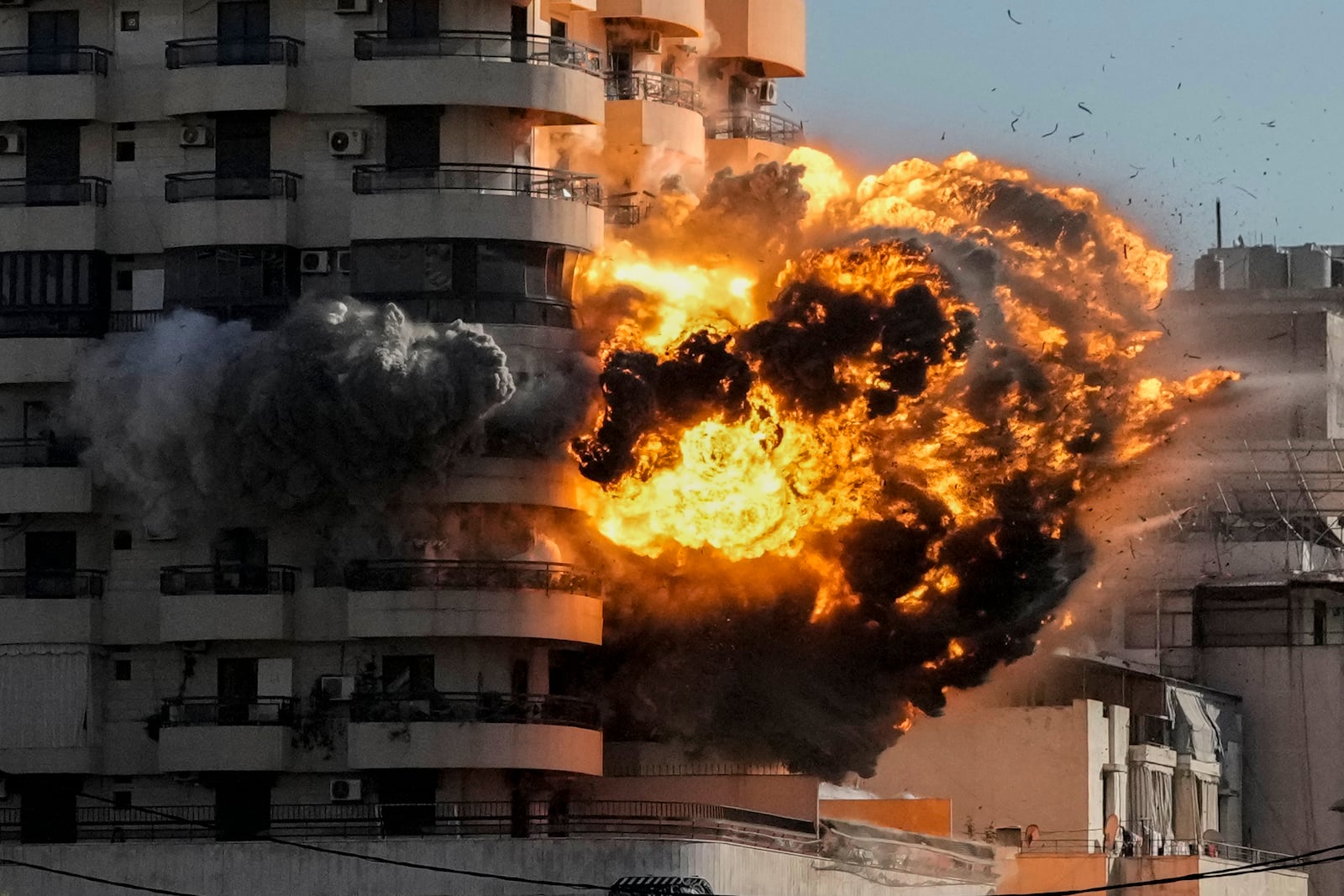 Smoke and flames erupt from a building hit in an Israeli airstrike in Chiyah, in the southern suburb of Beirut, Lebanon, Friday, Nov. 22, 2024. (AP Photo/Bilal Hussein)