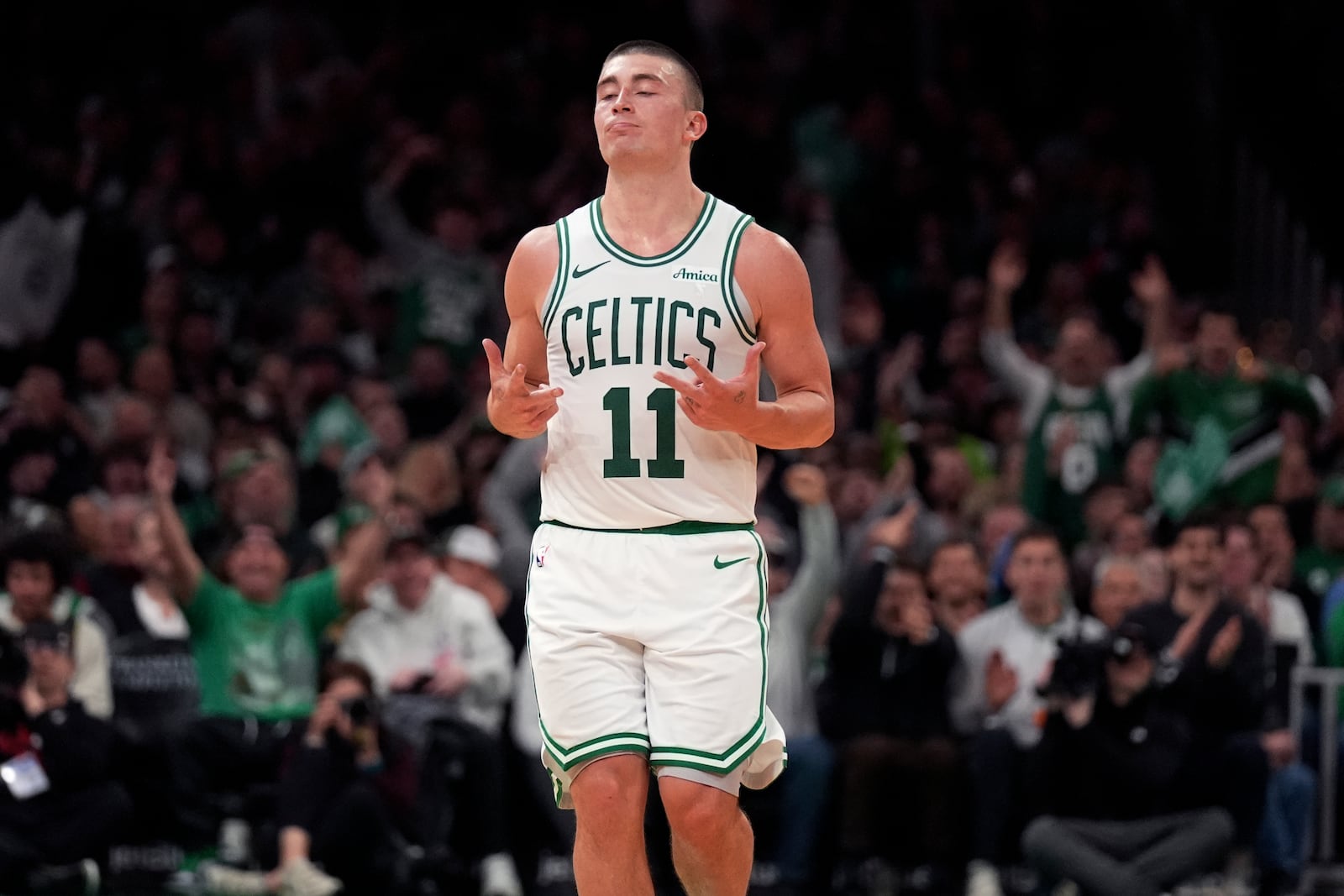 Boston Celtics guard Payton Pritchard (11) celebrates after hitting a 3-pointer against the Portland Trail Blazers during the second half of an NBA basketball game, Wednesday, March 5, 2025, in Boston. (AP Photo/Charles Krupa)