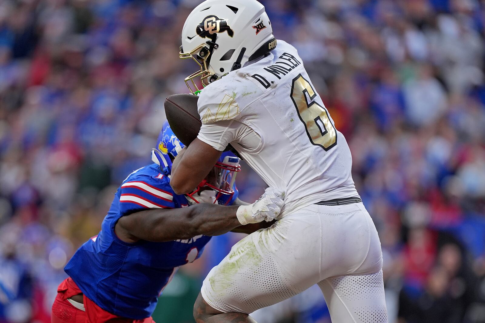 Colorado wide receiver Drelon Miller (6) catches the ball in the end zone to score a touchdown during the first half of an NCAA college football game against Kansas, Saturday, Nov. 23, 2024, in Kansas City, Mo. (AP Photo/Charlie Riedel)