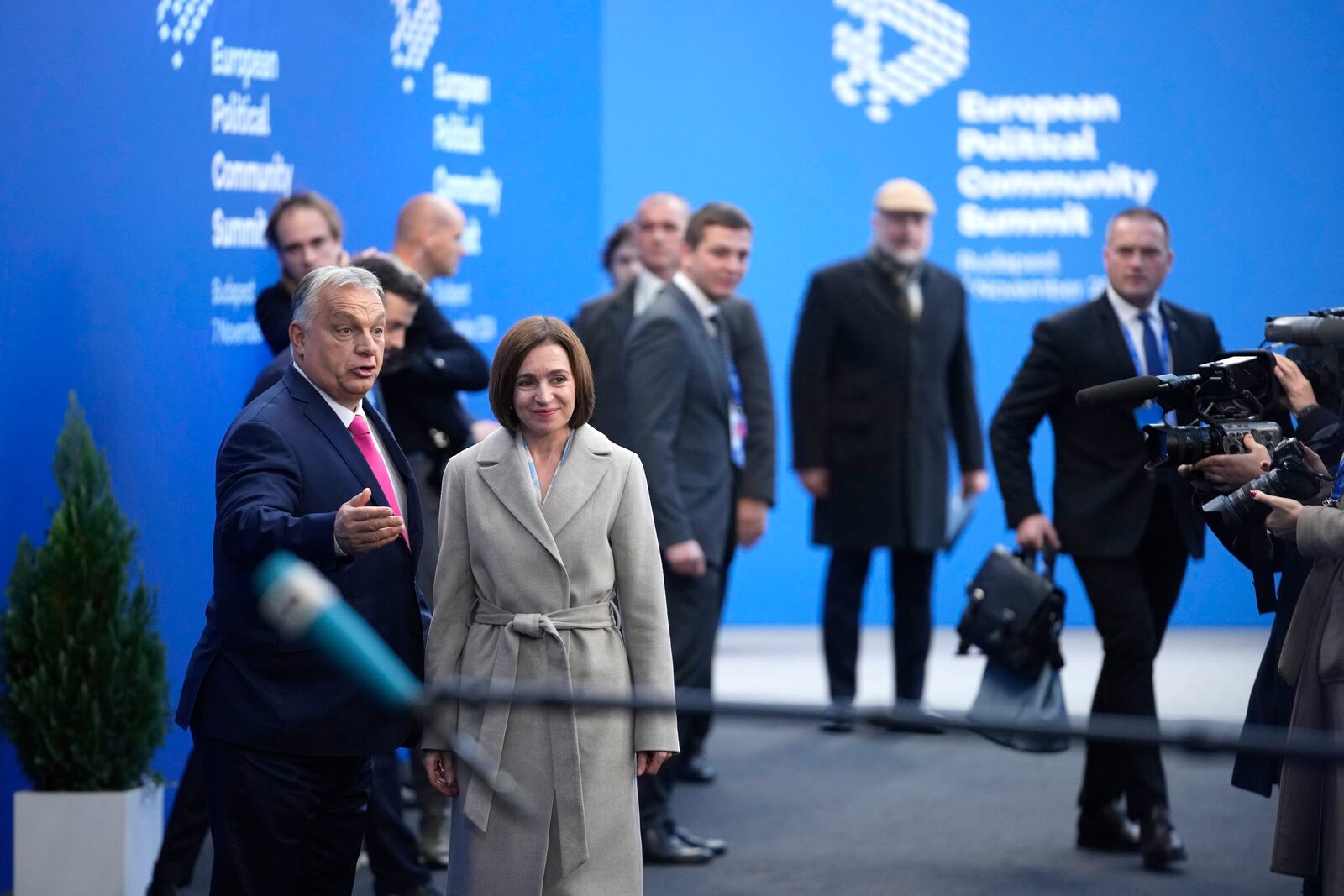 Hungary's Prime Minister Viktor Orban, left, welcomes Moldova's President Maia Sandu during arrivals for the European Political Community (EPC) Summit at the Puskas Arena in Budapest, Hungary, Thursday, Nov. 7, 2024. (AP Photo/Petr Josek)