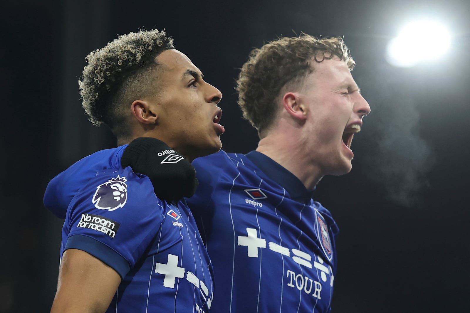 Ipswich Town's Omari Hutchinson, left celebrates with a teammate after scoring his sides second goal during the English Premier League soccer match between Ipswich Town and Chelsea at Portman Road stadium in Ipswich, England, Monday, Dec. 30, 2024. (AP Photo/Richard Pelham)