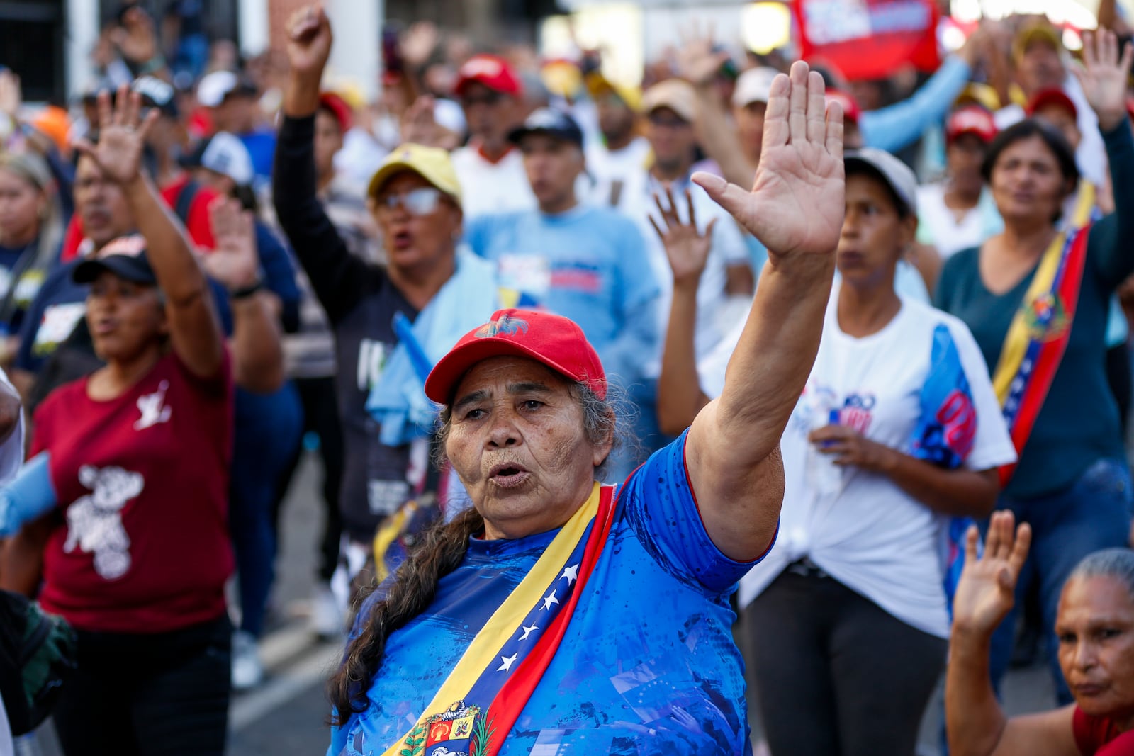 Government supporters listen to President Nicolas Maduro speaking on his inauguration day for a third term in Caracas, Venezuela, Friday, Jan. 10, 2025. (AP Photo/Cristian Hernandez)