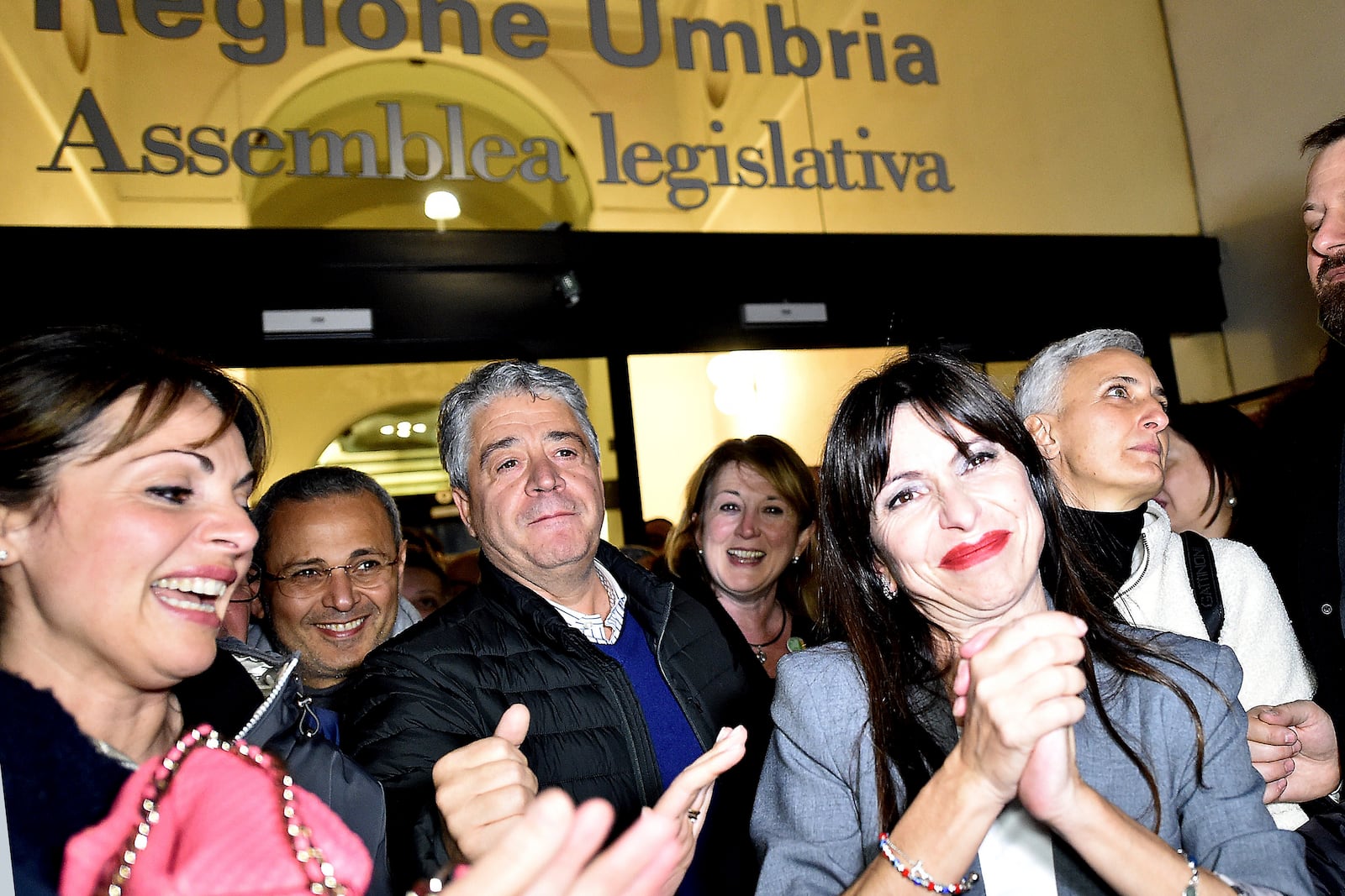 Center-left candidate Stefania Proietti, center right, celebrates following regional elections in the region of Umbria, in Perugia, Italy, late Monday, Nov. 18, 2024. (Roberto Settonce/LaPresse via AP)