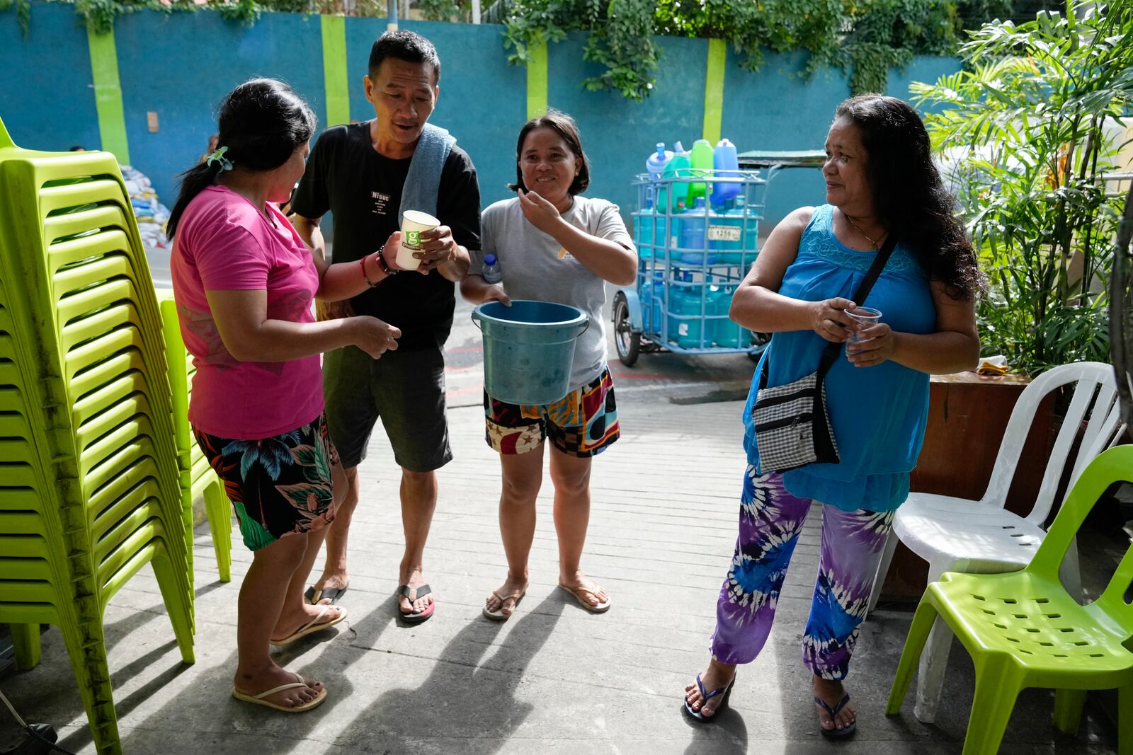 Residents line up to show their captured mosquito larvas in Mandaluyong city, Philippines as their village started offering bounty for captured mosquitos, dead or alive, as part of an anti-dengue campaign on Wednesday, Feb. 19, 2025. (AP Photo/Aaron Favila)