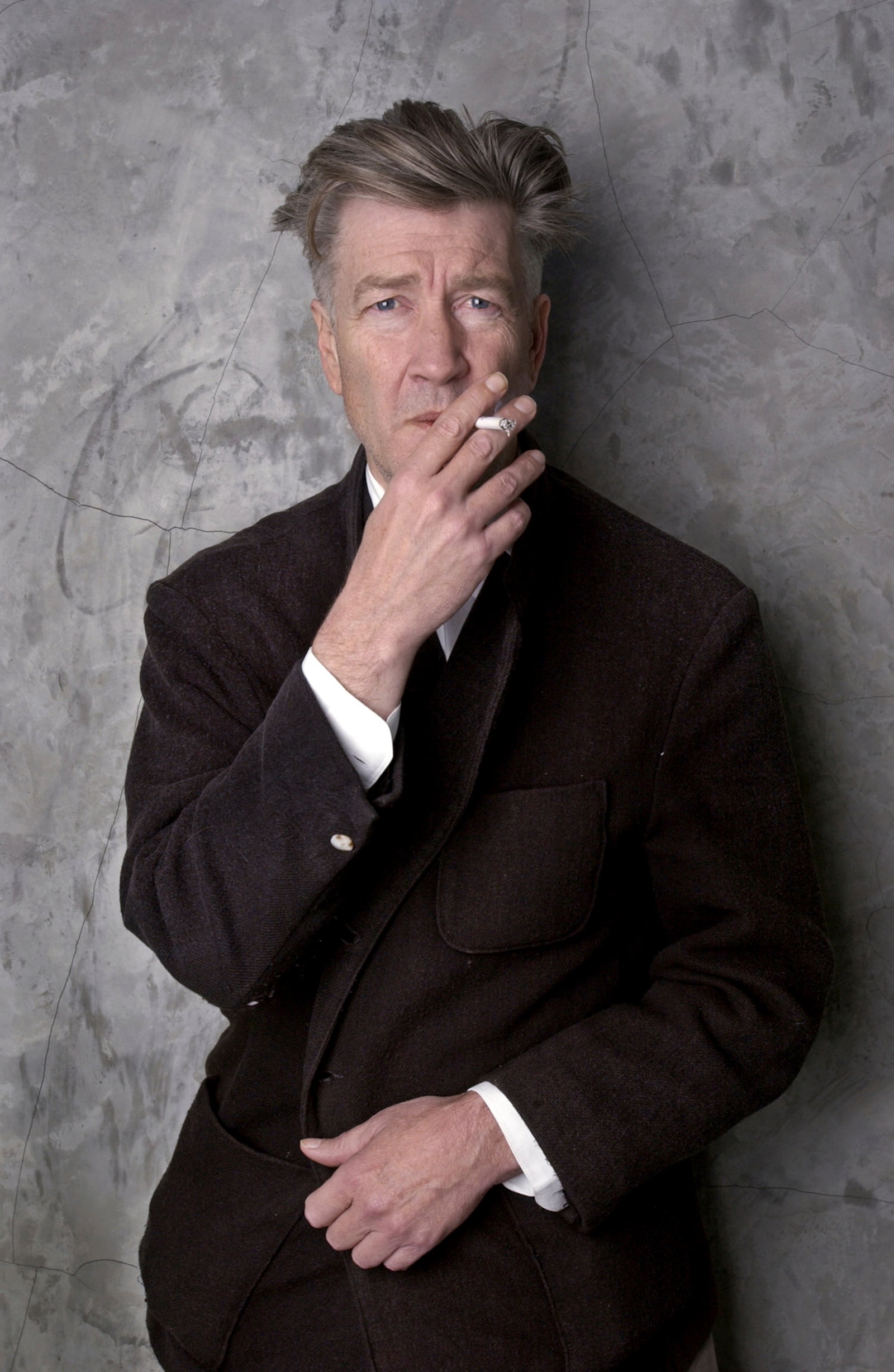 FILE - Filmmaker David Lynch poses at his Los Angeles home March 14, 2002. (AP Photo/Chris Weeks, File)