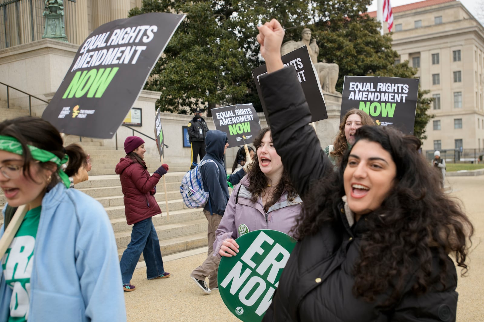 People hold a rally in front of the National Archives to highlight President Joe Biden's decision to declare the Equal Rights Amendment (ERA) as the 28th Amendment to the United States Constitution, Friday, Jan. 17, 2025, in Washington. (AP Photo/Rod Lamkey, Jr.)