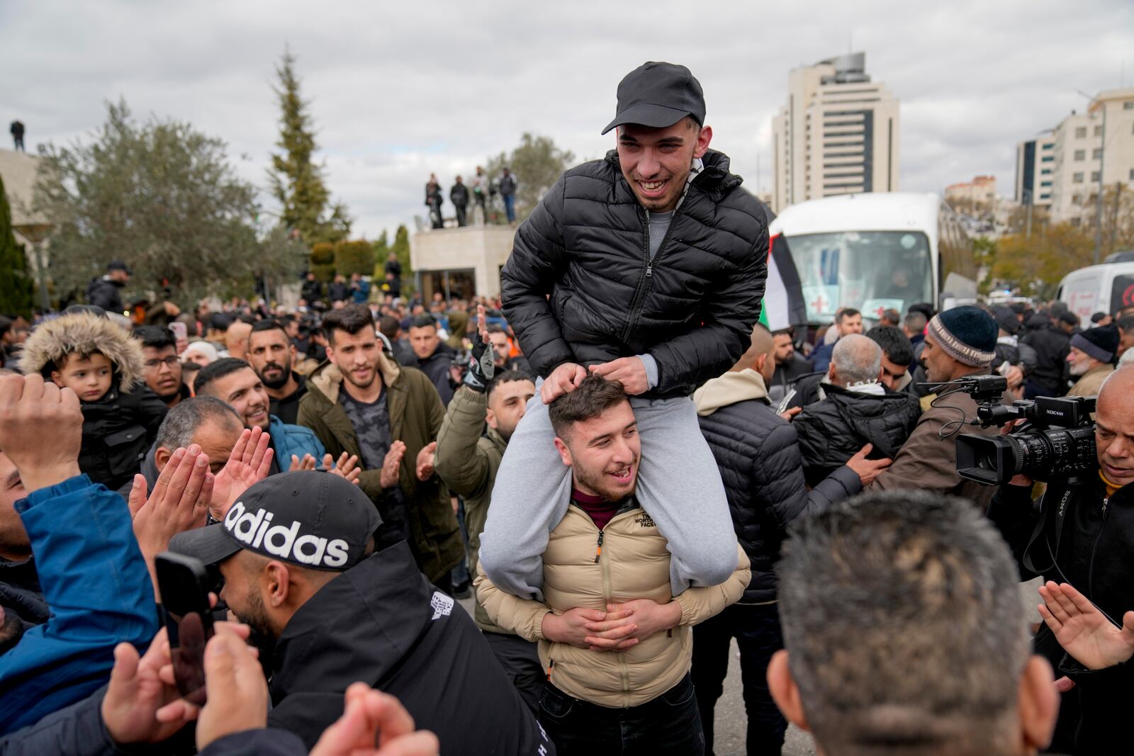 Palestinian prisoners are greeted after being released from Israeli prison following a ceasefire agreement between Israel and Hamas, in the West Bank city of Ramallah, Saturday Feb. 8, 2025. (AP Photo/Nasser Nasser)