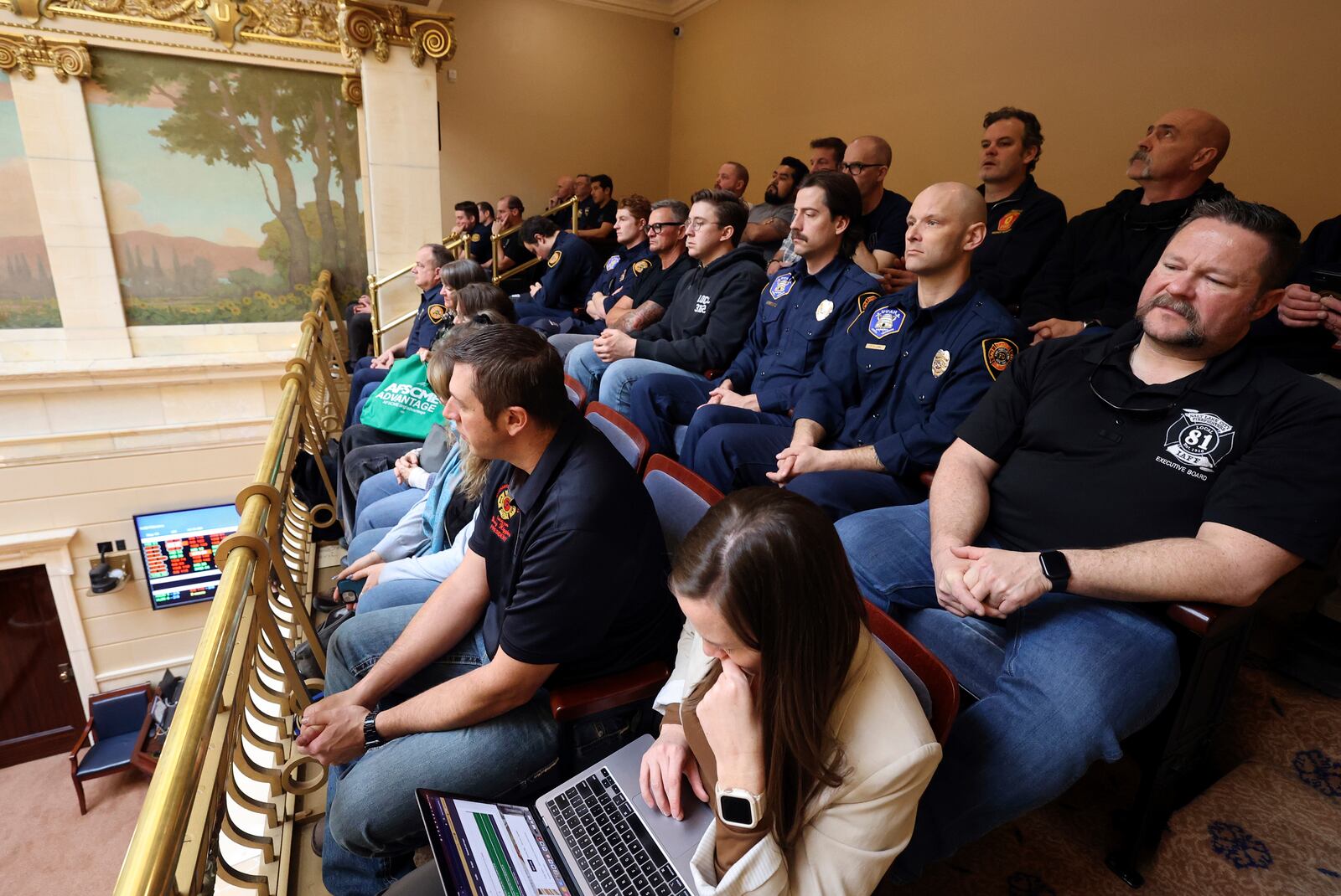 Jeff Kauffmann, Salt Lake City Firefighters Local 81 officer director, right, and other union members sit in the Senate gallery intending to hear discussion and voting on HB267 Public Sector Labor Union Amendments at the Capitol in Salt Lake City, Utah, on Wednesday, Feb. 5, 2025. (Kristin Murphy/ Deseret News via AP)