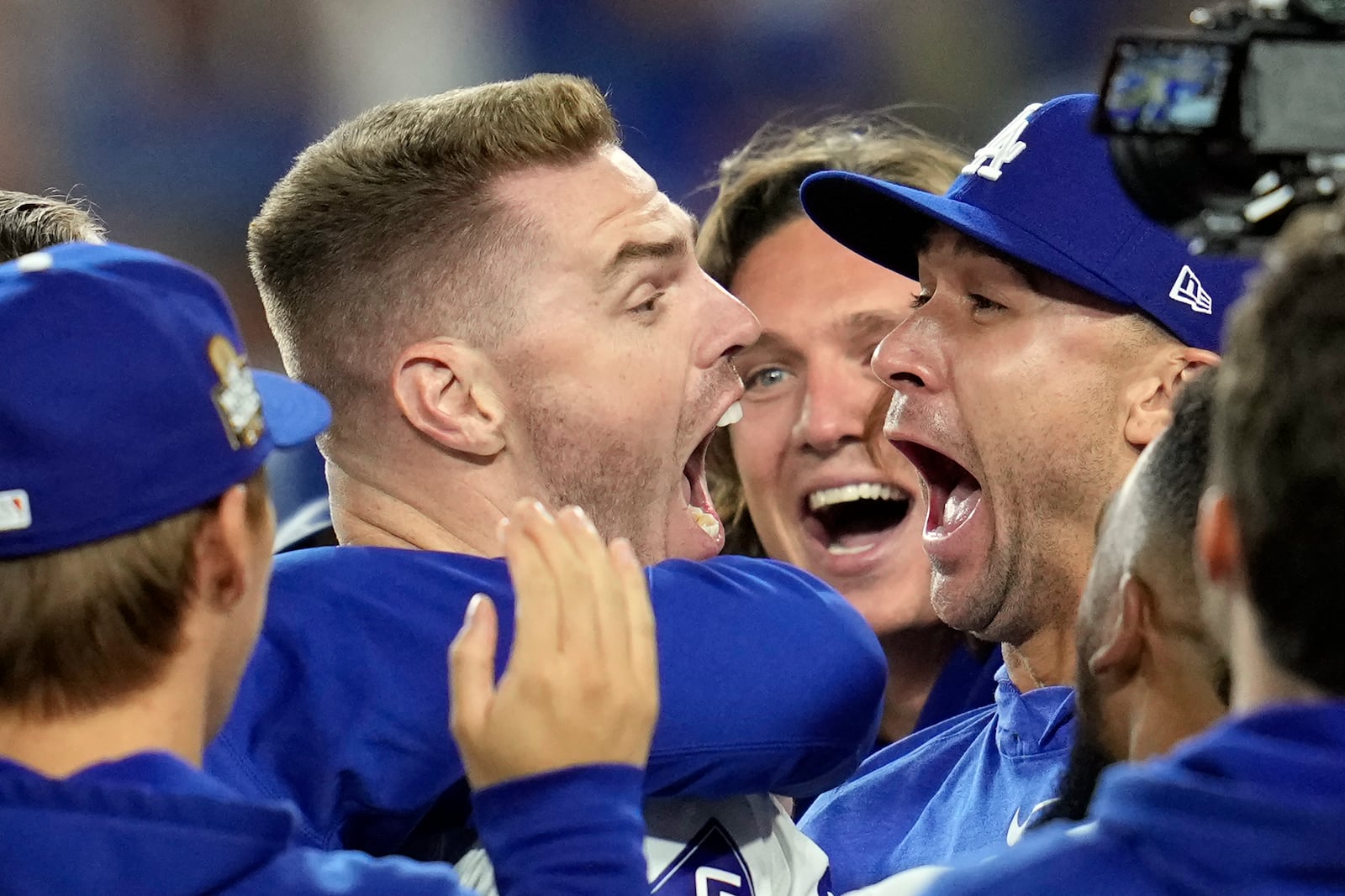 Los Angeles Dodgers' Freddie Freeman, left, celebrates with starting pitcher Jack Flaherty, right, and teammates after hitting a walk-off grand slam against the New York Yankees during the 10th inning in Game 1 of the baseball World Series, Friday, Oct. 25, 2024, in Los Angeles. The Dodgers won 6-3. (AP Photo/Godofredo A. Vásquez)