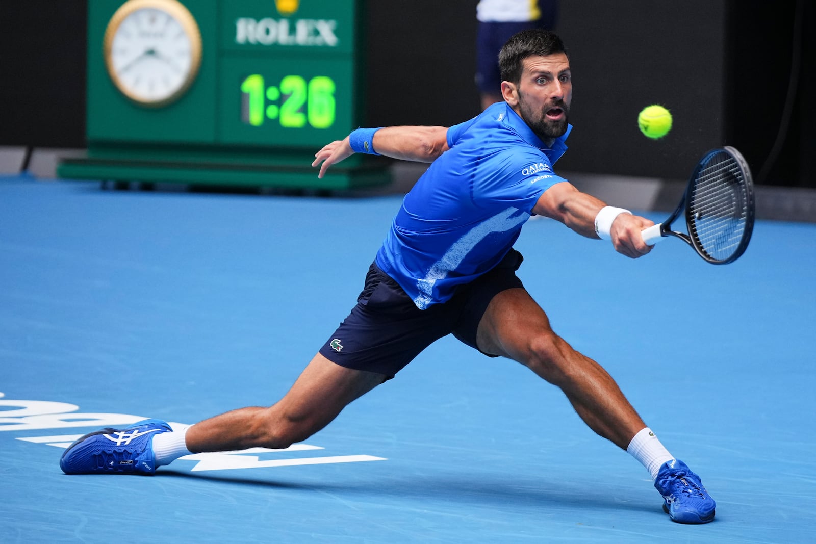 Novak Djokovic of Serbia plays a backhand return to Jaime Faria of Portugal during their second round match at the Australian Open tennis championship in Melbourne, Australia, Wednesday, Jan. 15, 2025. (AP Photo/Vincent Thian)