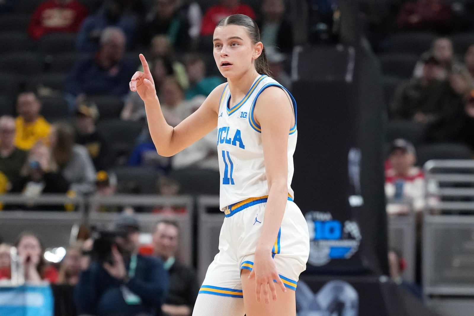 UCLA guard Gabriela Jaquez (11) signals against Nebraska during the second half of an NCAA college basketball game in the quarterfinals of the Big Ten Conference tournament in Indianapolis, Friday, March 7, 2025. (AP Photo/AJ Mast)