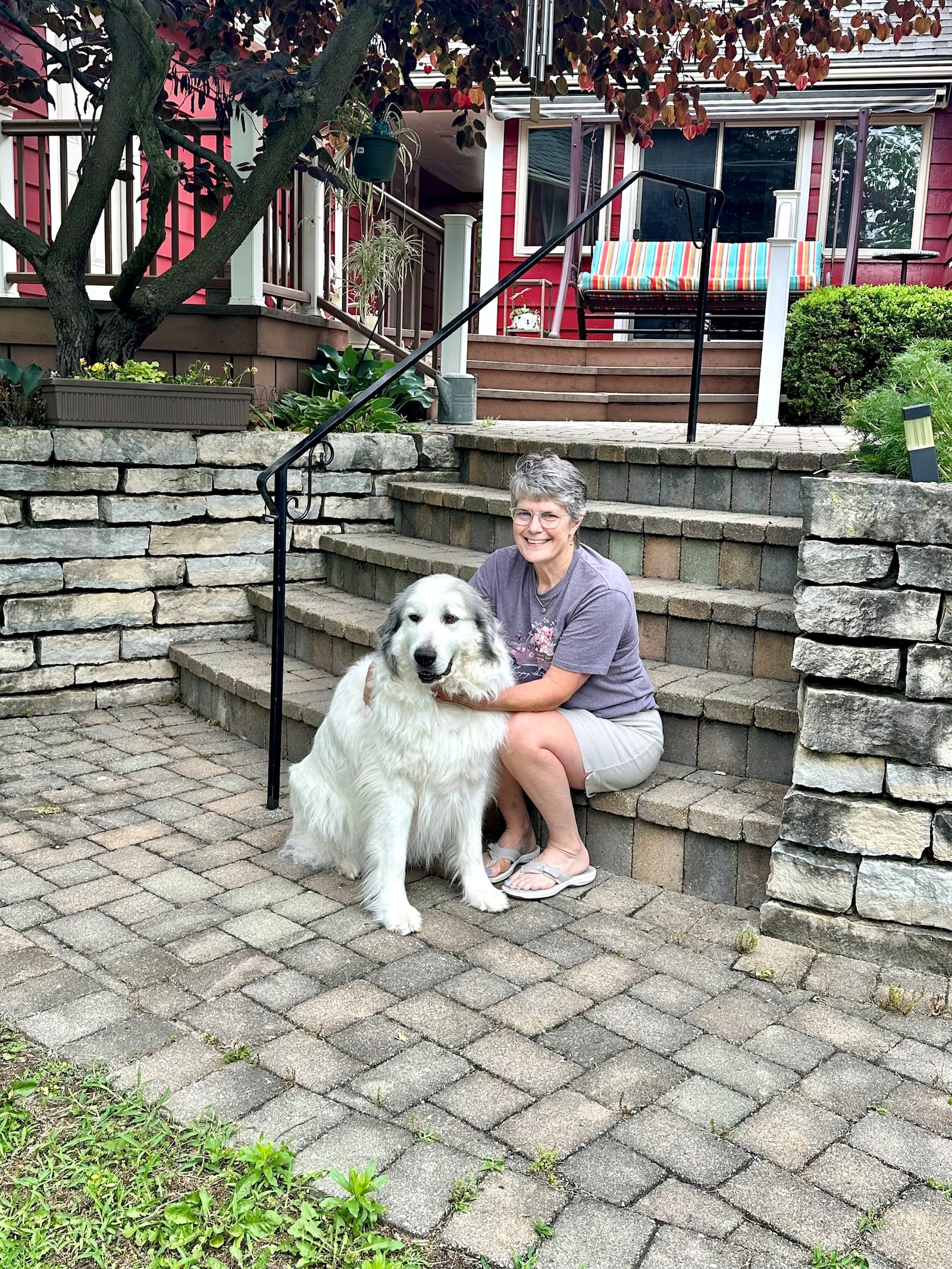 Susan Walters Crowe sits on the back patio of the home she shares with husband Rick and their dog. ROBIN McMACKEN / STAFF 