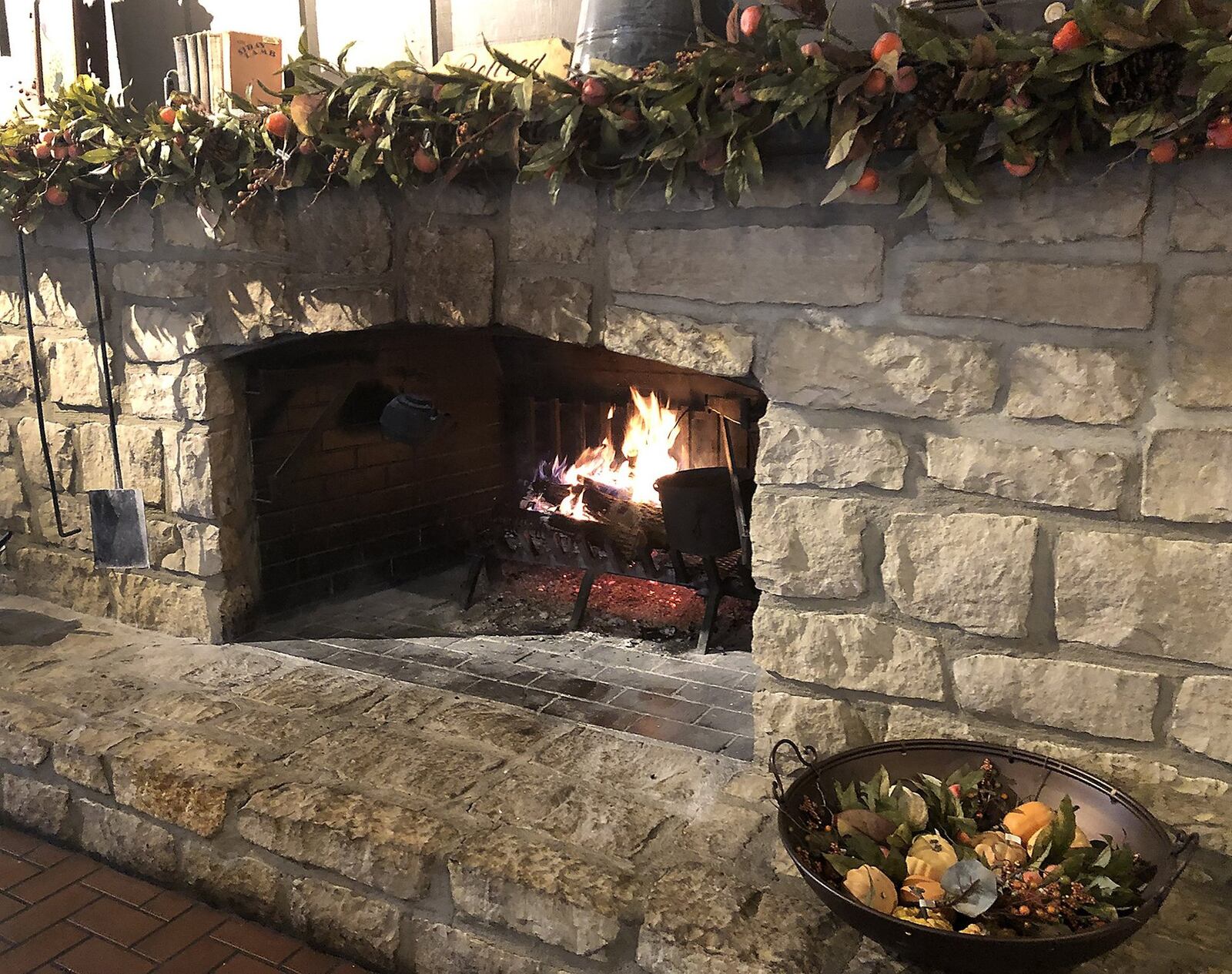 A crackling fire burns in a fire place in the dining room at Cracker Barrel. BILL LACKEY/STAFF