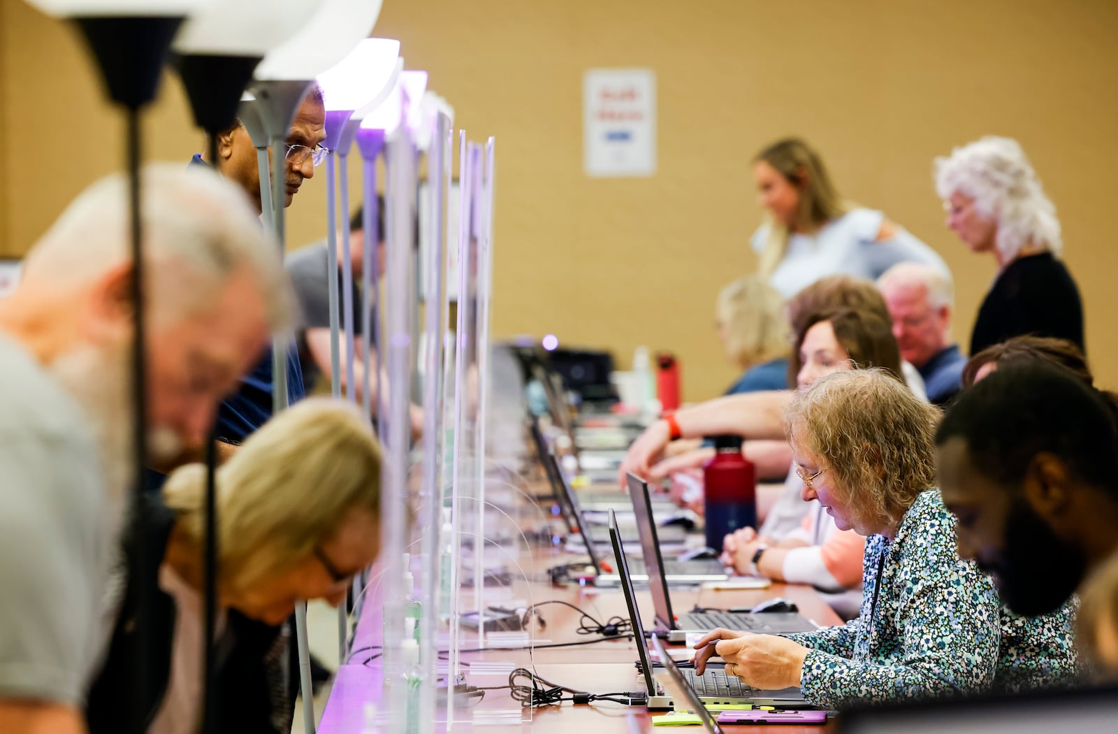 In this file photo from 2022, poll workers are seen during early voting at the Butler County Board of Elections. NICK GRAHAM/FILE