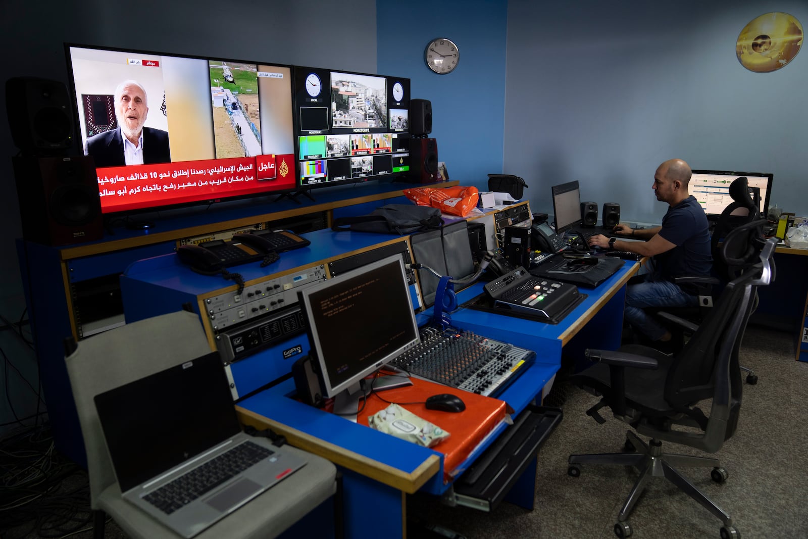 FILE- Al Jazeera broadcast engineer Mohammad Salameh works at the Master Control Room unit inside the network's office in the West Bank city of Ramallah on May 5, 2024. (AP Photo/Nasser Nasser, File)