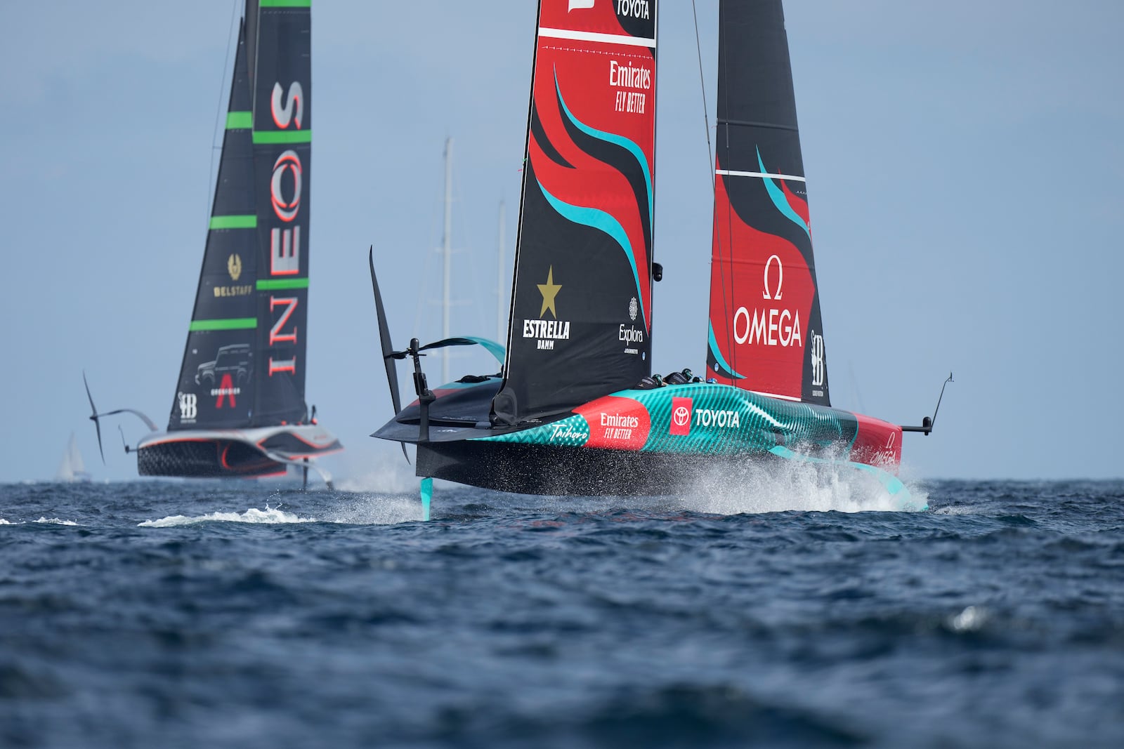 Ineos Britannia and Emirates Team New Zealand race during the Louis Vuitton 37th America's Cup Day 2 race in Barcelona, Spain, Sunday, Oct. 13, 2024. (AP Photo/Bernat Armangue)