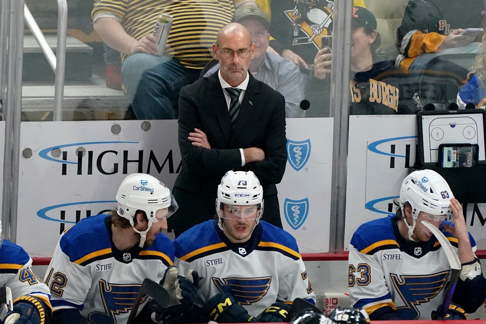 FILE - St. Louis Blues head coach Drew Bannister stands behind the bench during the first period of an NHL hockey game against the Pittsburgh Penguins, Dec. 30, 2023, in Pittsburgh. (AP Photo/Matt Freed, File)