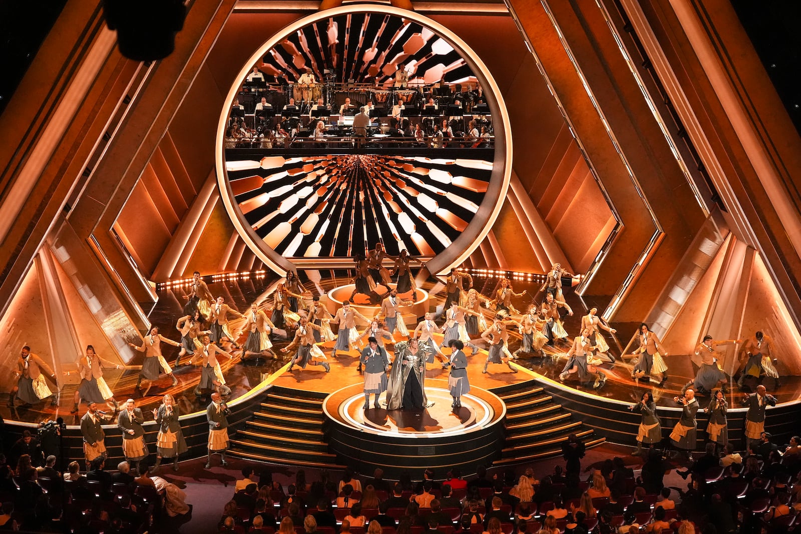 Queen Latifah, center, performs "Ease on Down the Road" during the Oscars on Sunday, March 2, 2025, at the Dolby Theatre in Los Angeles. (AP Photo/Chris Pizzello)