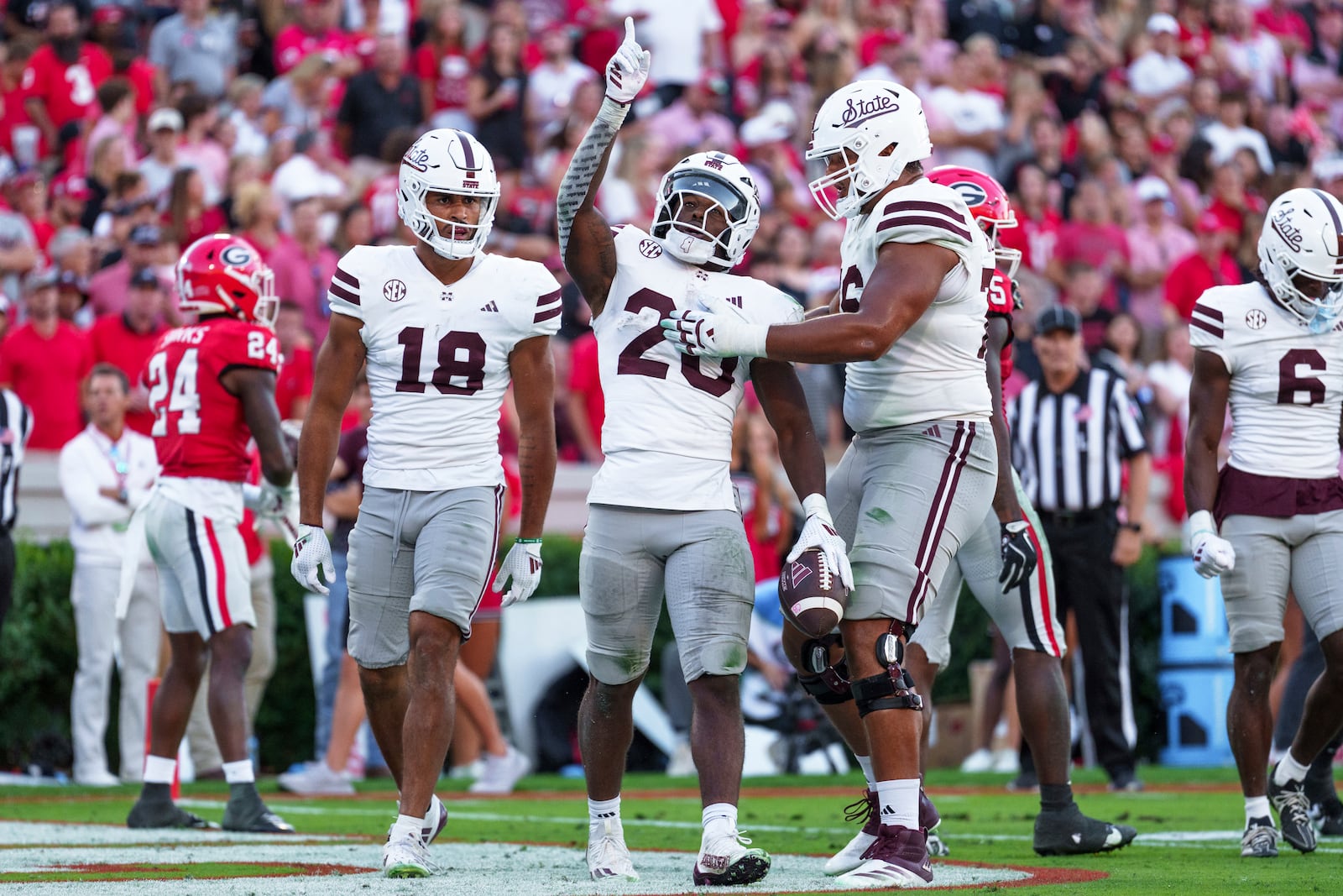 Mississippi State running back Johnnie Daniels (20) celebrates after scoring a touchdown during an NCAA college football game against Georgia, Saturday, Oct. 12, 2024, in Athens, Ga. (AP Photo/Jason Allen)