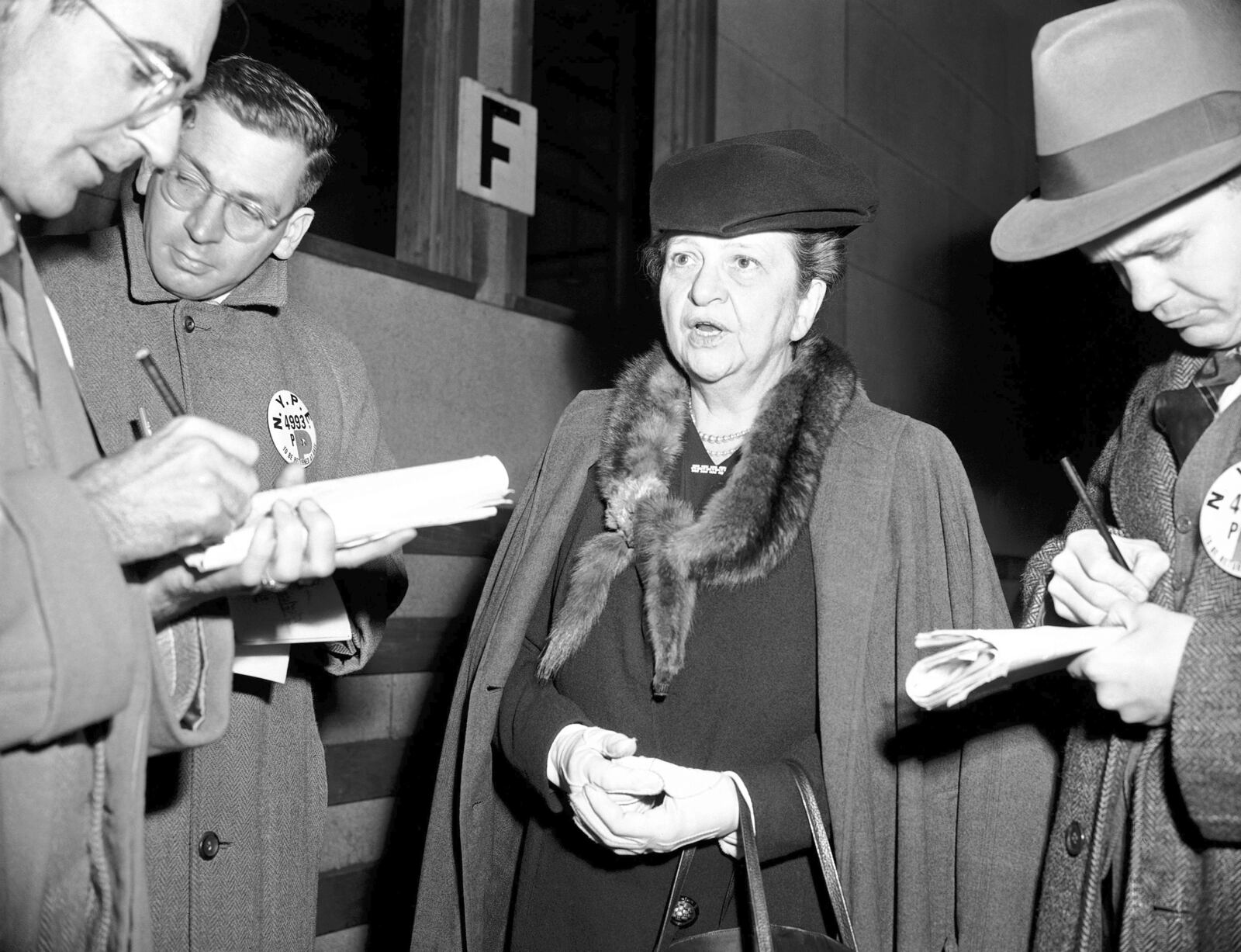 FILE - Former Secretary of Labor Frances Perkins chats with reporters in New York, Nov. 27, 1945, as she arrives from Europe aboard the Queen Mary, after she headed the American Government's delegation to the International Labor Organization conference in Paris. (AP Photo/Harry Harris, File)