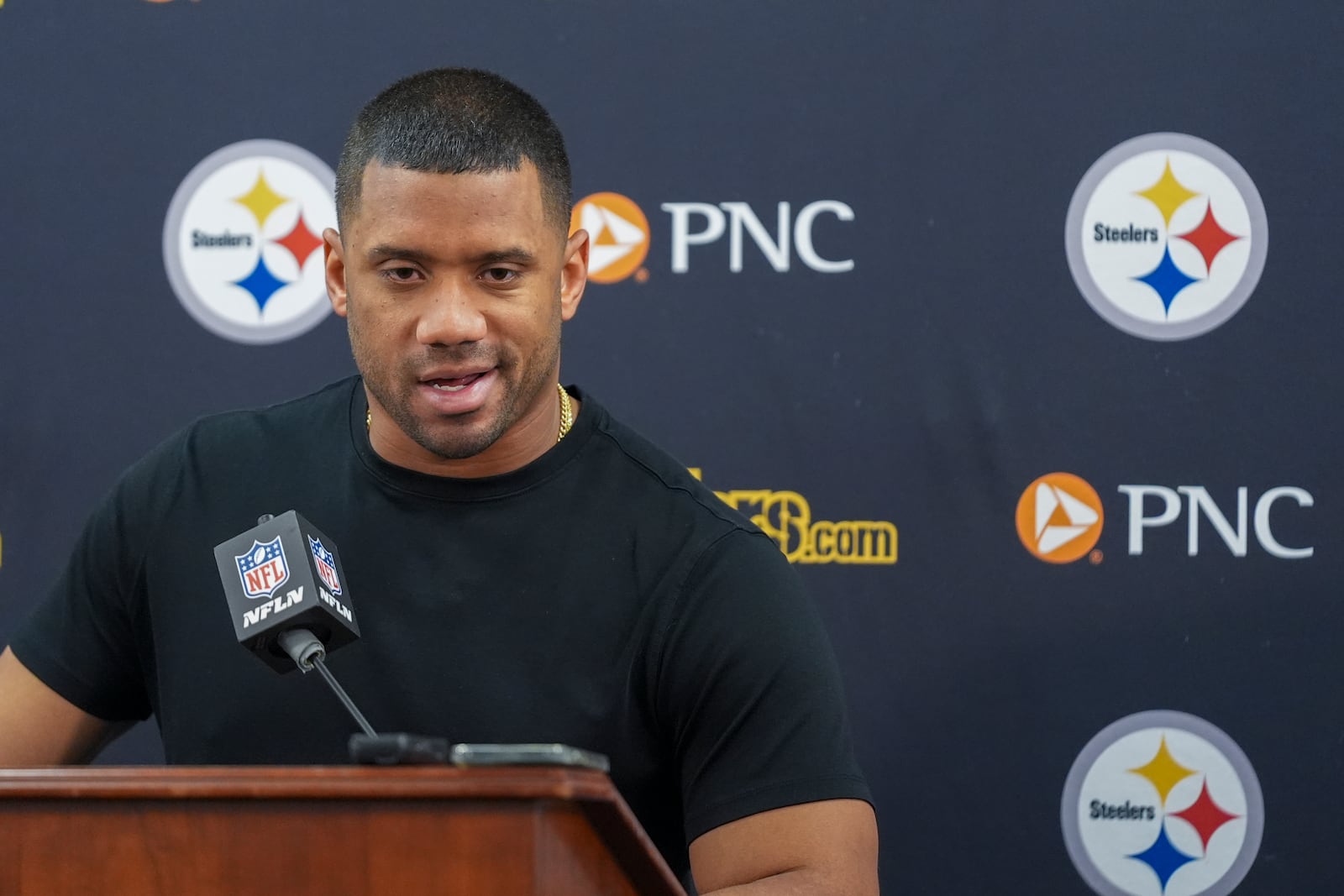 Pittsburgh Steelers quarterback Russell Wilson talks to reporters following an NFL football game against the Baltimore Ravens, Saturday, Dec. 21, 2024, in Baltimore. The Ravens won 34-17. (AP Photo/Stephanie Scarbrough)