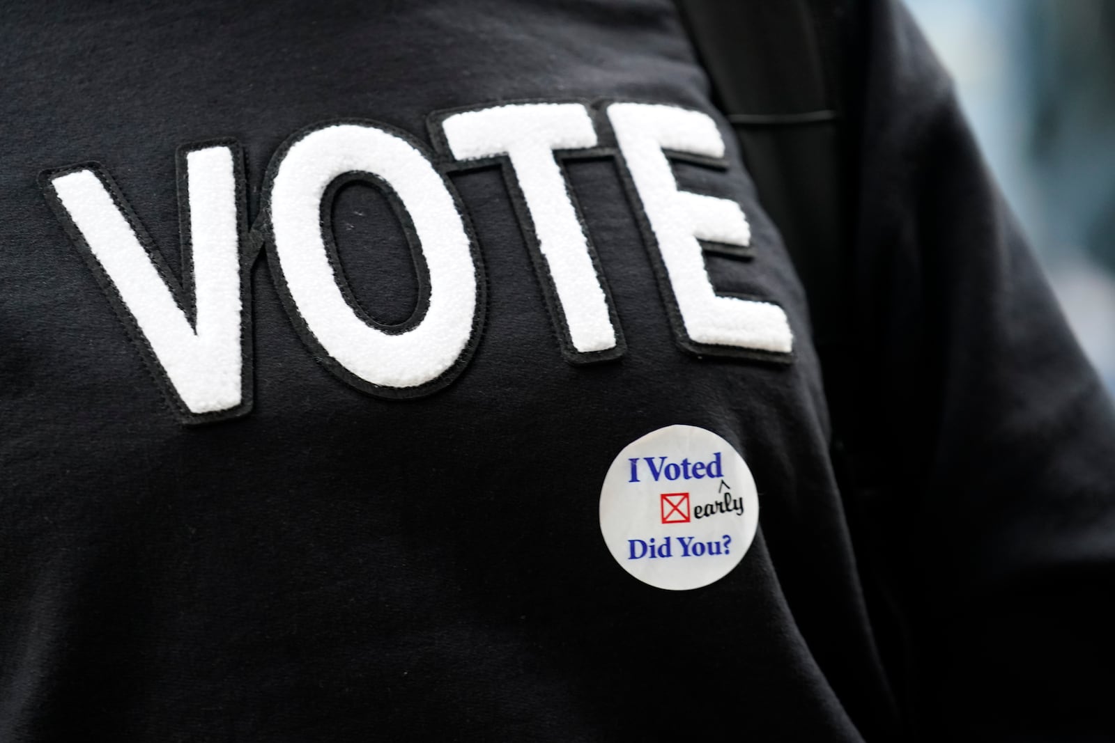 Tamera Drain wears an "I Voted" sticker on her sweatshirt during a get out the vote rally at North Carolina A&T in Greensboro, N.C., Monday, Oct. 28, 2024. (AP Photo/Chuck Burton)