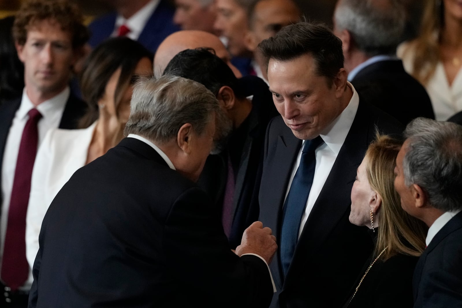 Victor Knavs talks with Elon Musk before the 60th Presidential Inauguration in the Rotunda of the U.S. Capitol in Washington, Monday, Jan. 20, 2025. (AP Photo/Julia Demaree Nikhinson, Pool)