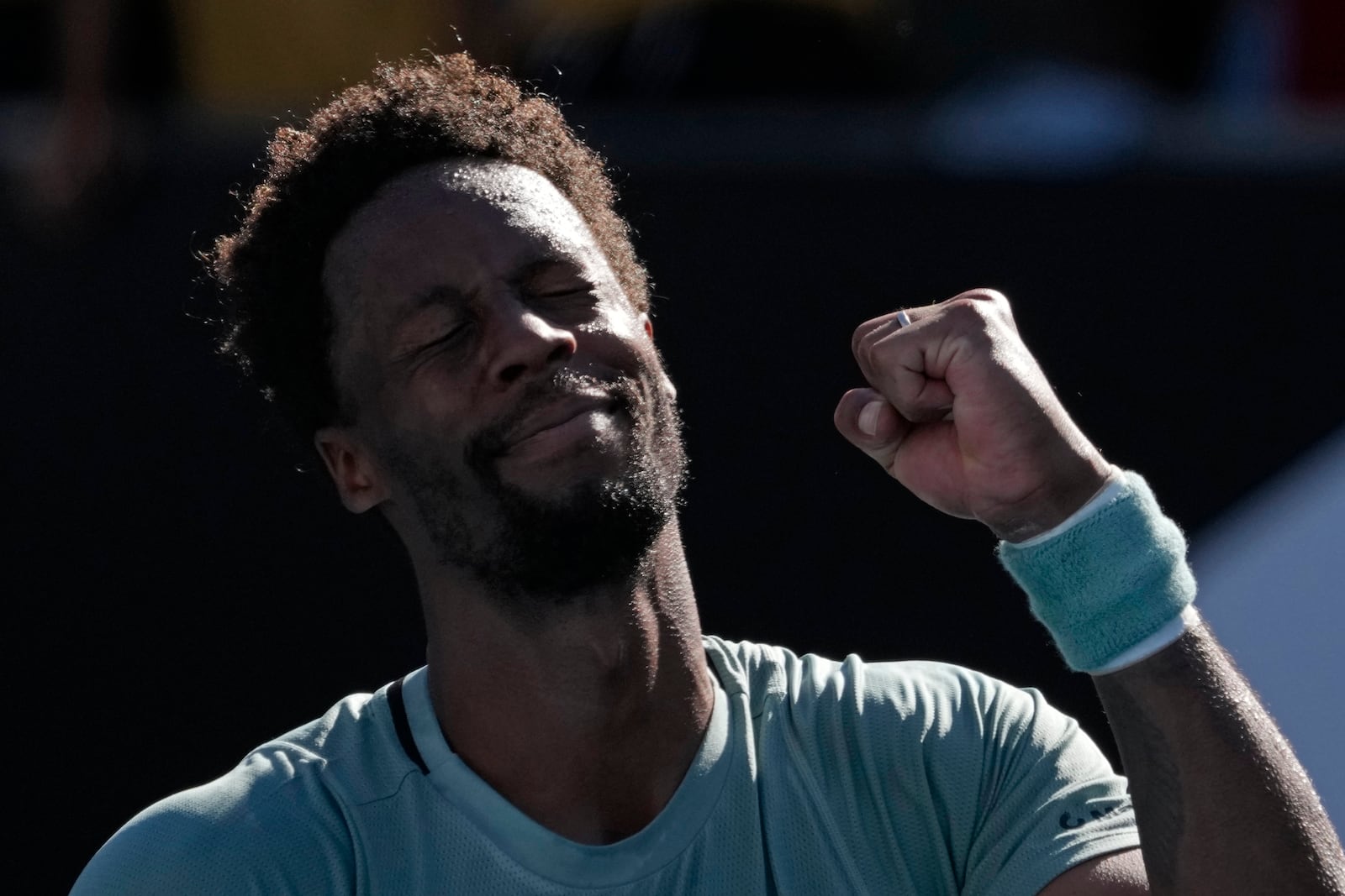 Gael Monfils of France celebrates after defeating compatriot Giovanni Mpetshi Perricard in their first round match at the Australian Open tennis championship in Melbourne, Australia, Tuesday, Jan. 14, 2025. (AP Photo/Manish Swarup)