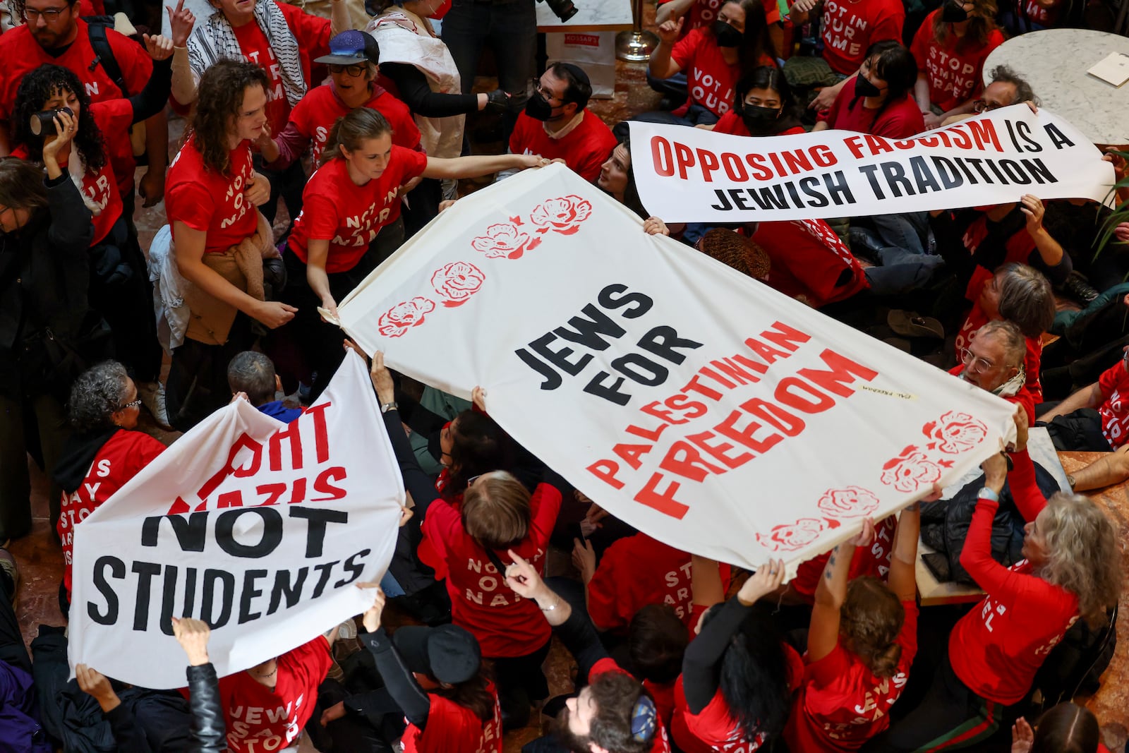 Demonstrators from the group, Jewish Voice for Peace, protest inside Trump Tower in support of Columbia graduate student Mahmoud Khalil, Thursday, March 13, 2025, in New York. (AP Photo/Yuki Iwamura)