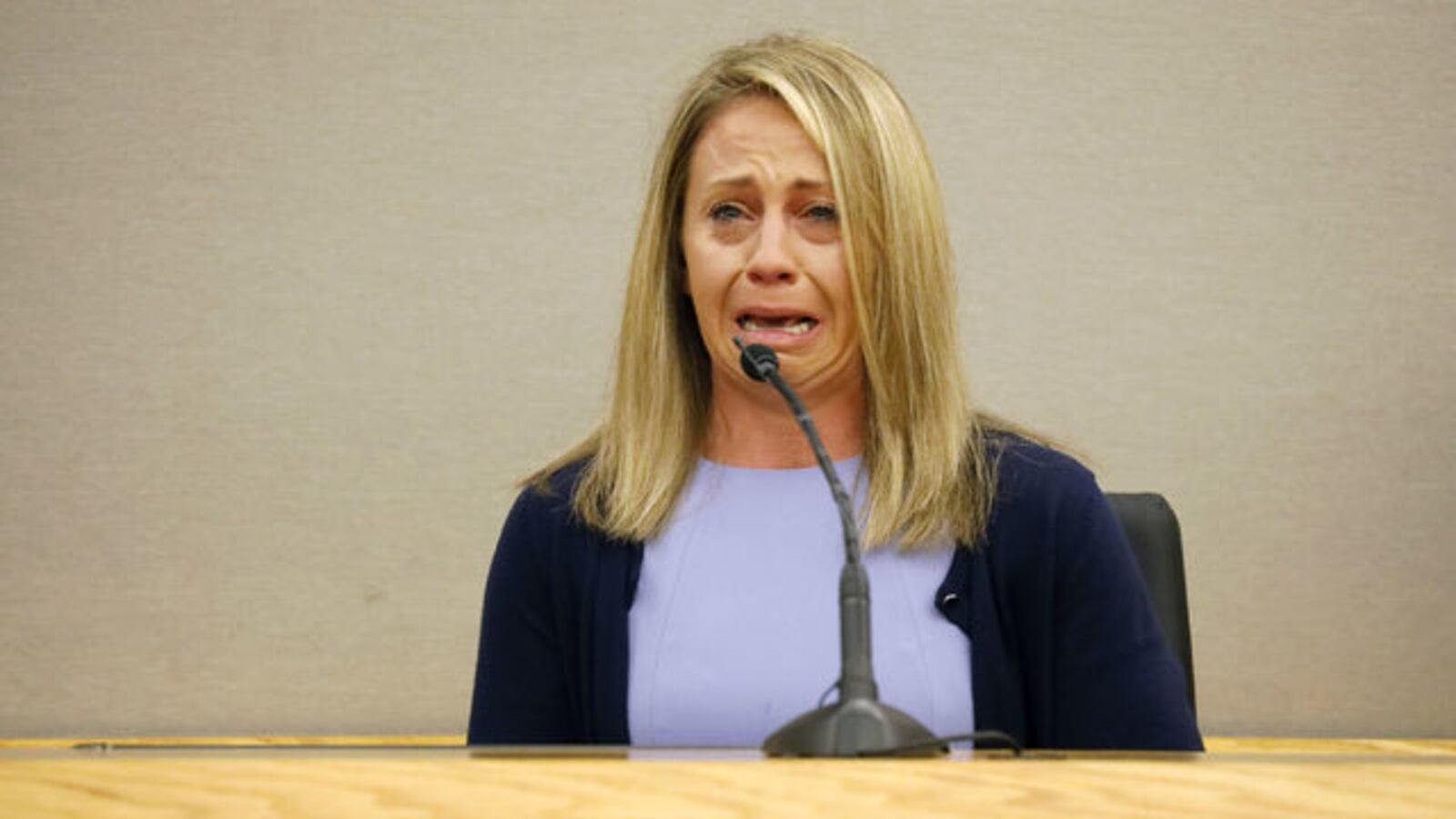 Former Dallas cop Amber Guyger weeps on the stand during her murder trial in the September 2018 killing of her neighbor, Botham Jean. Guyger, 31, was convicted and sentenced Wednesday, Oct. 2, 2019, to 10 years in prison.