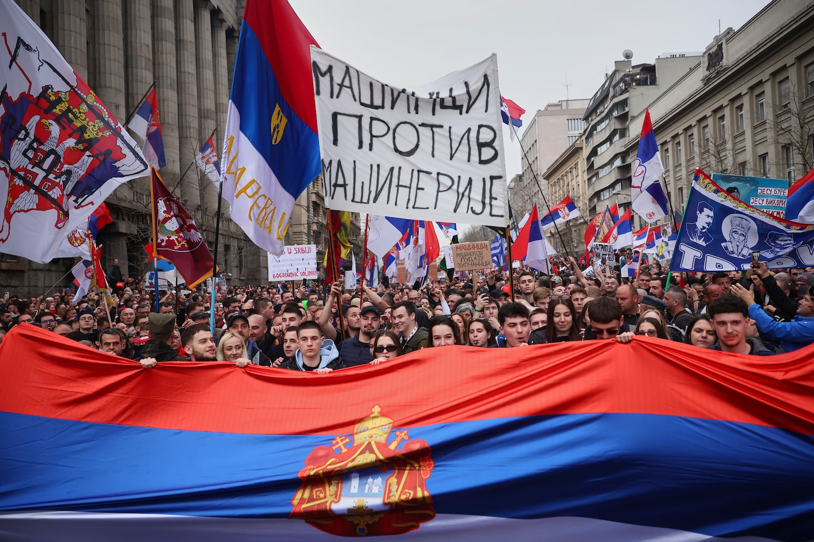 Protesters march during a major rally against populist President Aleksandar Vucic and his government, in downtown Belgrade, Serbia, Saturday, March 15, 2025. (AP Photo/Armin Durgut)