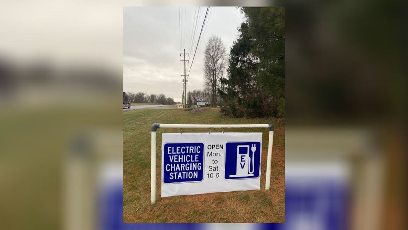 Roadside sign for electric vehicle charging station in front Freshwater Farms of Ohio in Champaign County. Contributed