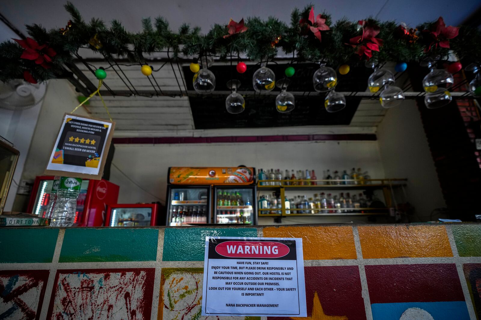 A notice displayed at the bar of Nana Backpack hostel in Vang Vieng, Laos, Tuesday, Nov. 19, 2024. (AP Photo/Anupam Nath)