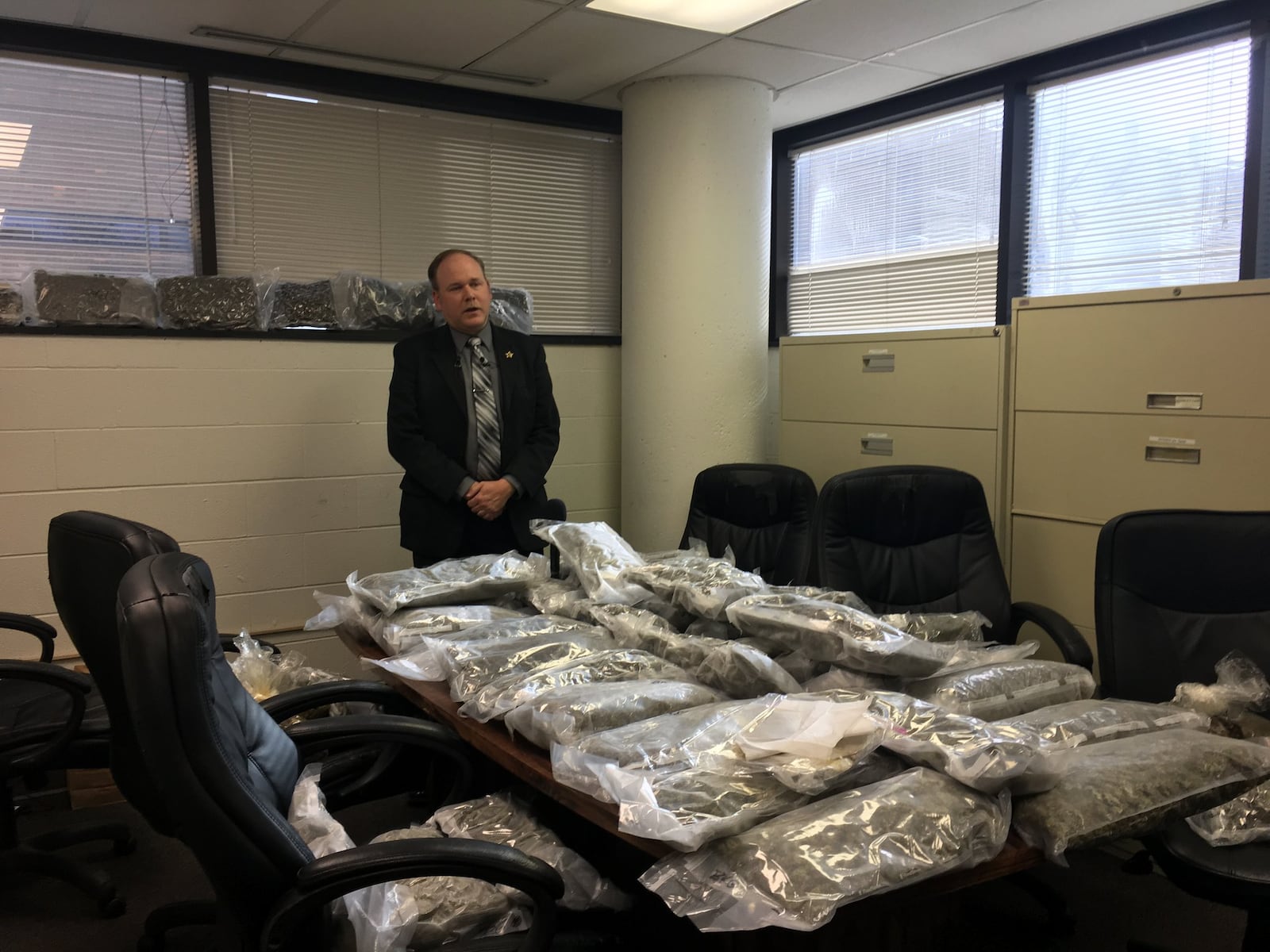 Lt. Kris Shultz with more than 50 pounds of marijuana found during a bust by Clark County deputies. Allyson Brown/Staff