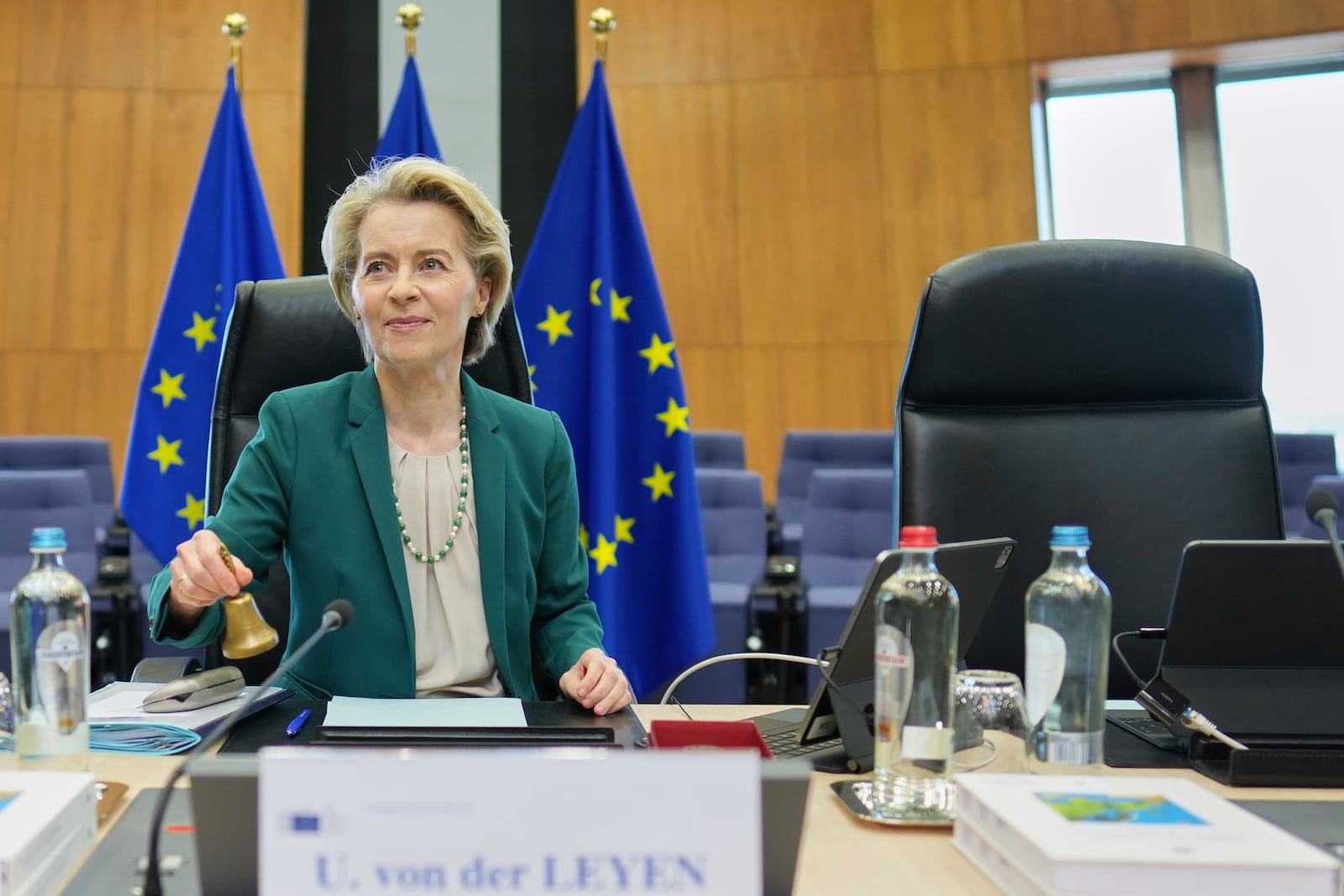 European Commission President Ursula von der Leyen rings a bell to signify the start of the weekly College of Commissioners meeting at EU headquarters in Brussels, Wednesday, March 19, 2025. (AP Photo/Virginia Mayo)