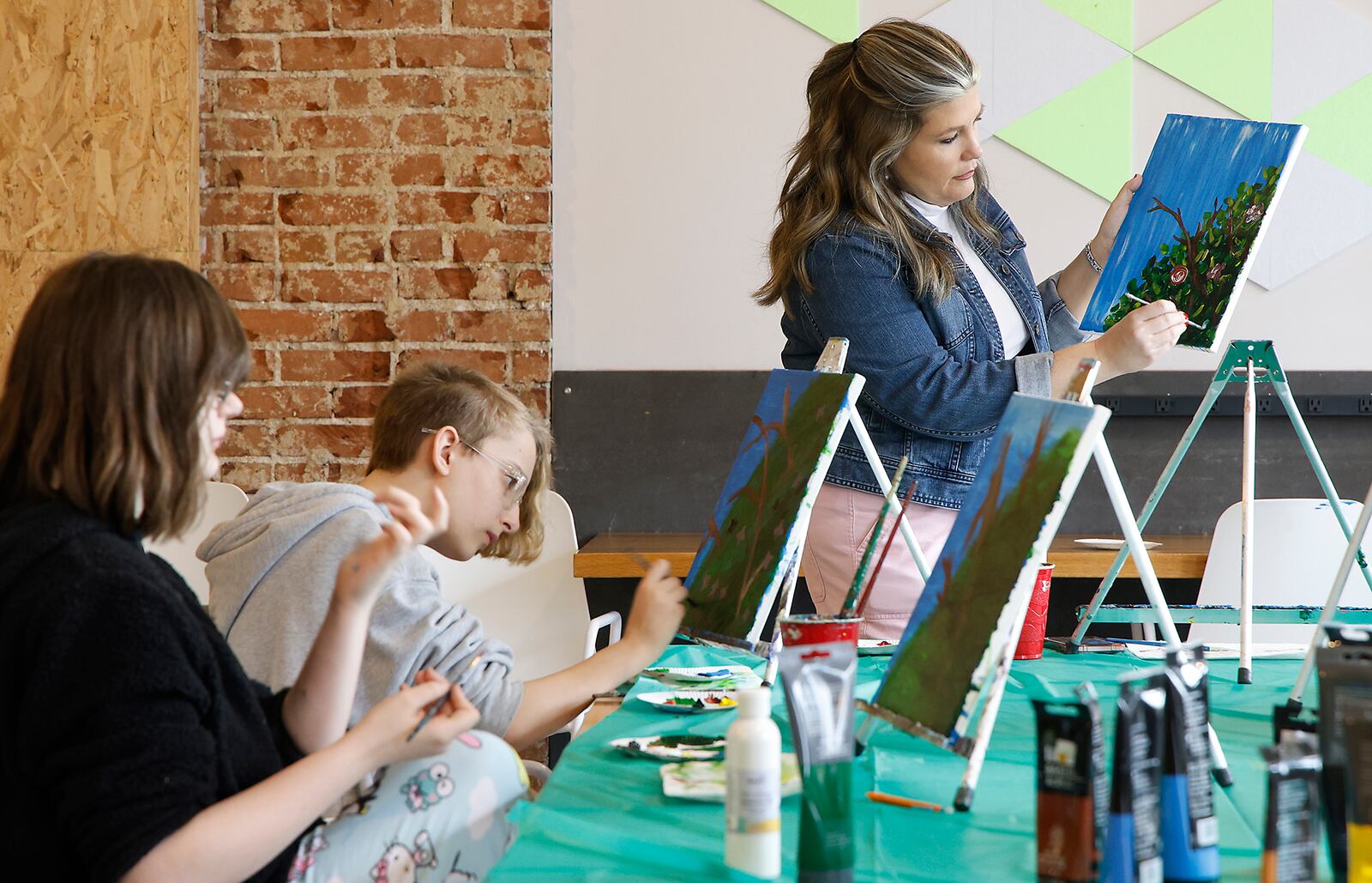 For International Women's Day, young women in the 7th and 8th grades from Hayward Middle School got to showcase their painting ability at the Springfield COhatch Friday, March 8, 2024. The young ladies got a chance to talk with Springfield City Commissioner Tracey Tackett and hear how she started her own business, Sip & Dipity Paint Bar, on her road to the City Commission. The event was sponsored by the "My Sister's Keeper" program, which matches young women with mentors. BILL LACKEY/STAFF