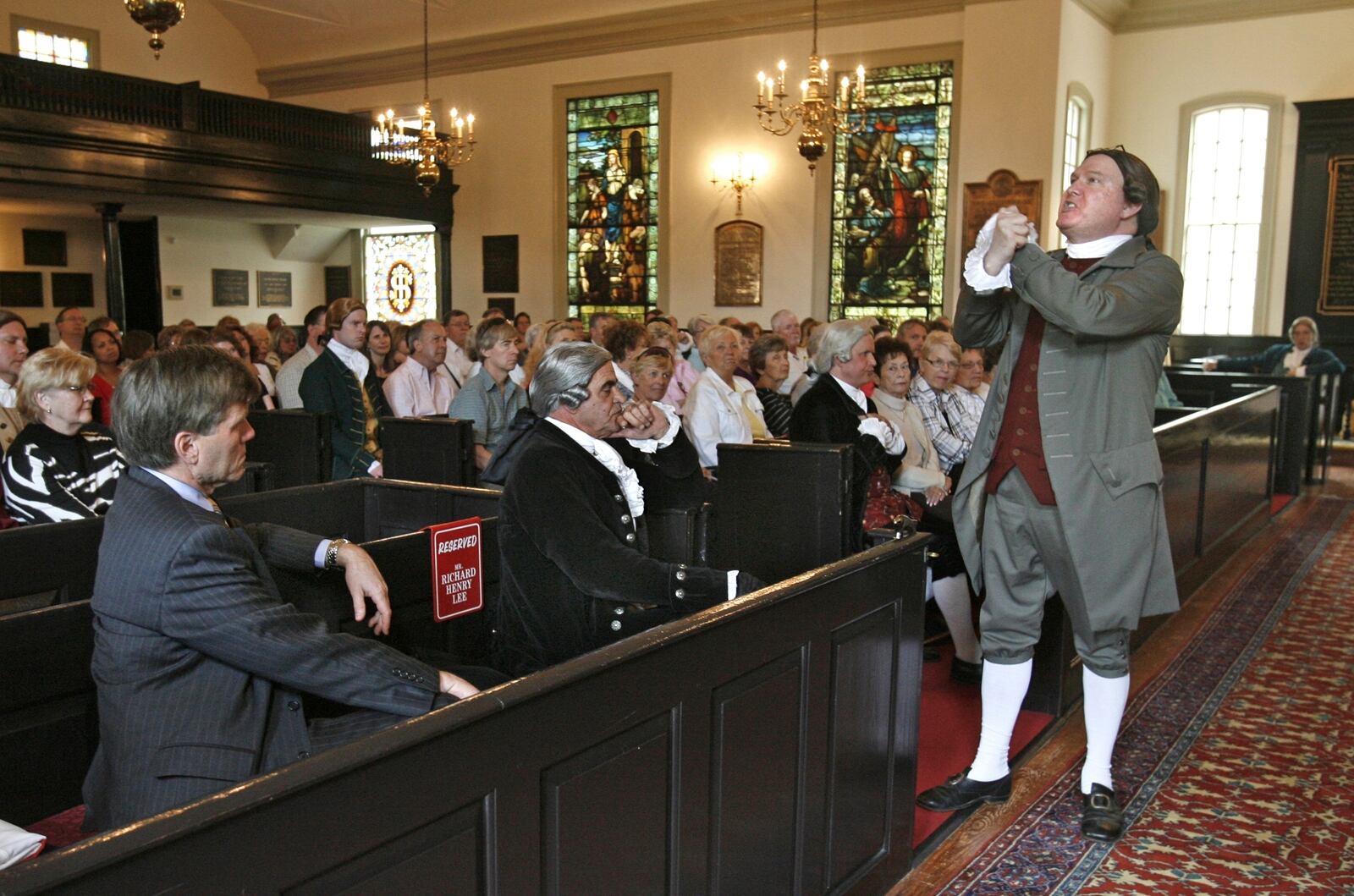 FILE - Virginia Governor Bob McDonnell, left, listens as historical interpreter Michael Wells delivers the "Liberty or Death" speech as Patrick Henry in St. John's Church, Sunday, April 25, 2010. (AP Photo/Richmond Times-Dispatch, P. Kevin Morley, File)